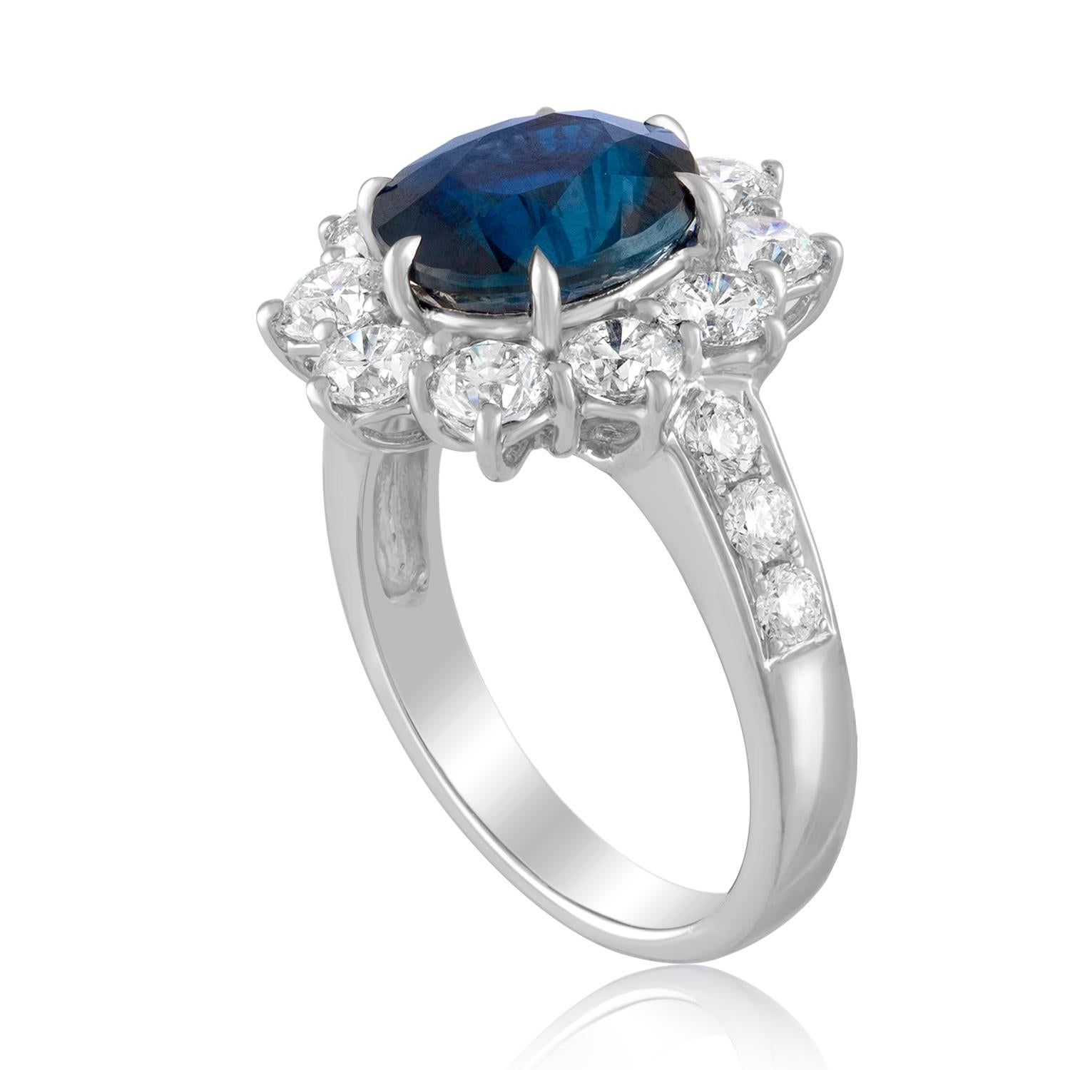 Beautiful Classic Oval Halo Ring.
The ring is 18K White Gold.
The ring has 2.13 Carats in Diamonds F VS.
The center stone is an oval shaped 4.07 Carat Blue Sapphire.
The Sapphire is certified by AGL, NO HEAT.
The top of the ring measures 17.67 mm x