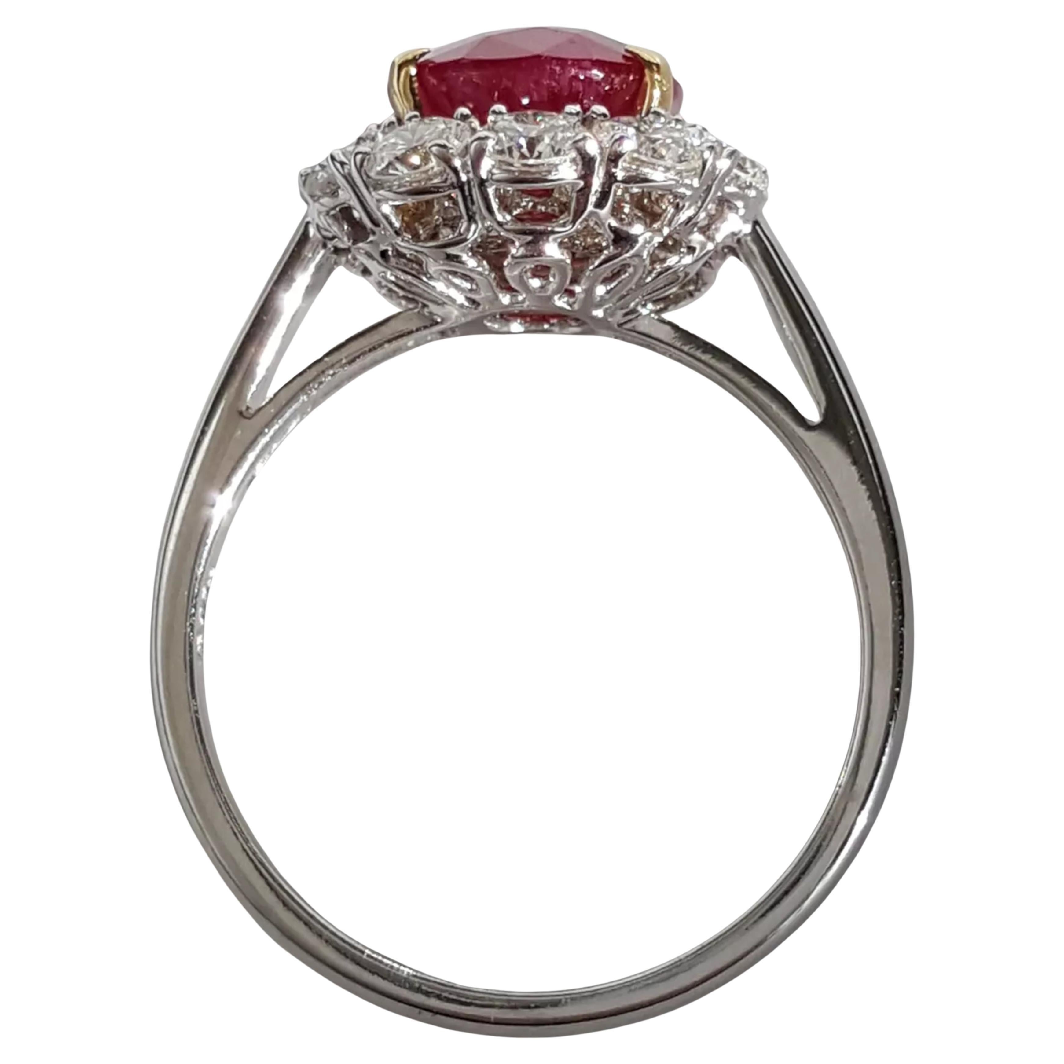 breathtaking engagement ring crafted from 18k white gold, featuring a stunning 4.12 ct Burma ruby at its center, weighing an impressive 3.02 ct. The ruby, measuring 9.79 x 7.71 x 4.27 mm, is known to look even more exquisite in person than in
