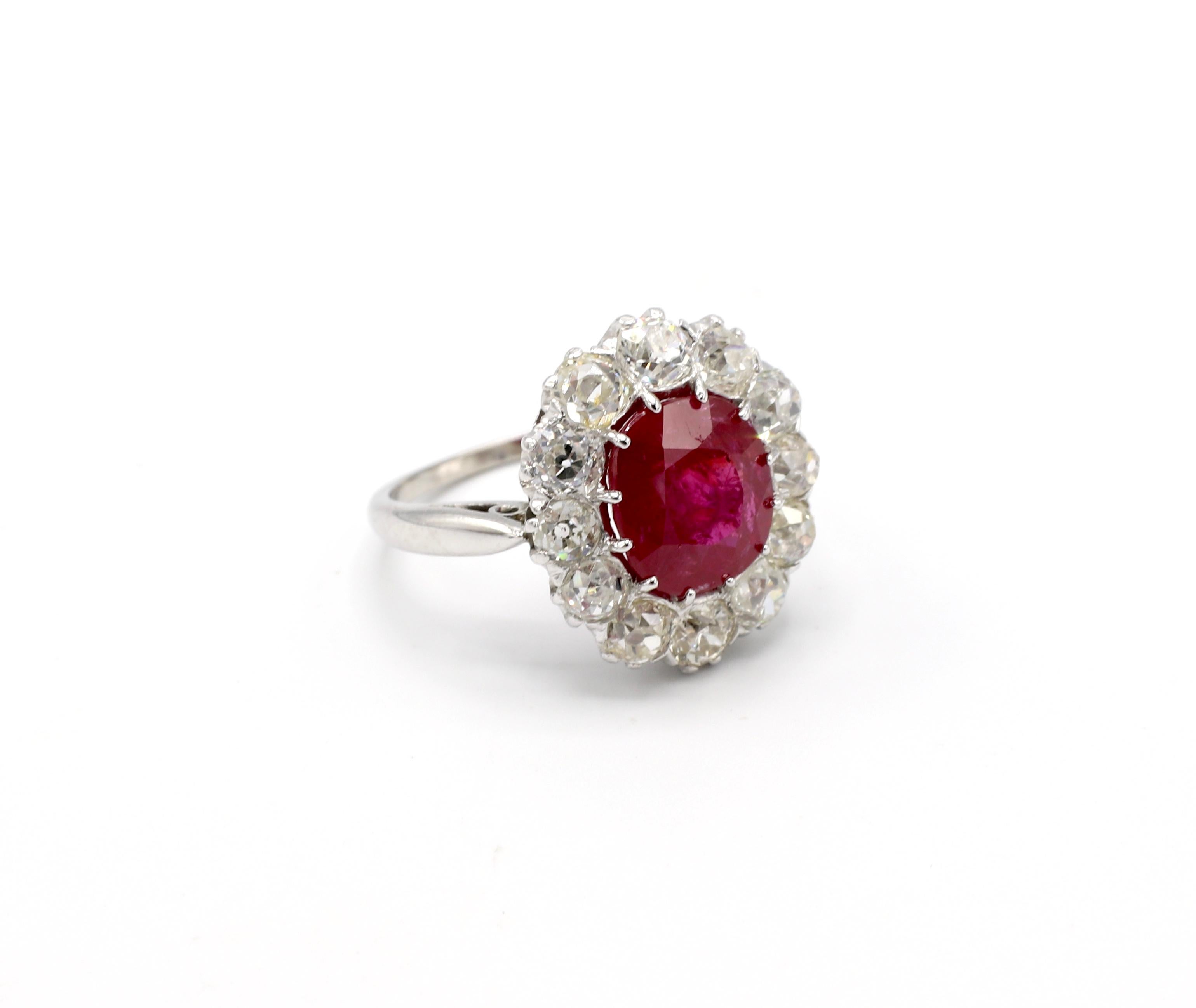AGL Certified 4.30 Carat Burma Ruby & Mine Cut Diamond Ring 

Ruby: 4.30 carats, cushion cut, natural, no heat, Burma. Please note AGL certificate pictured for details. 
Diamonds: 12 mine cut diamonds, approx. 2.40 carats, G-I VS 
Size: 8
Metal: