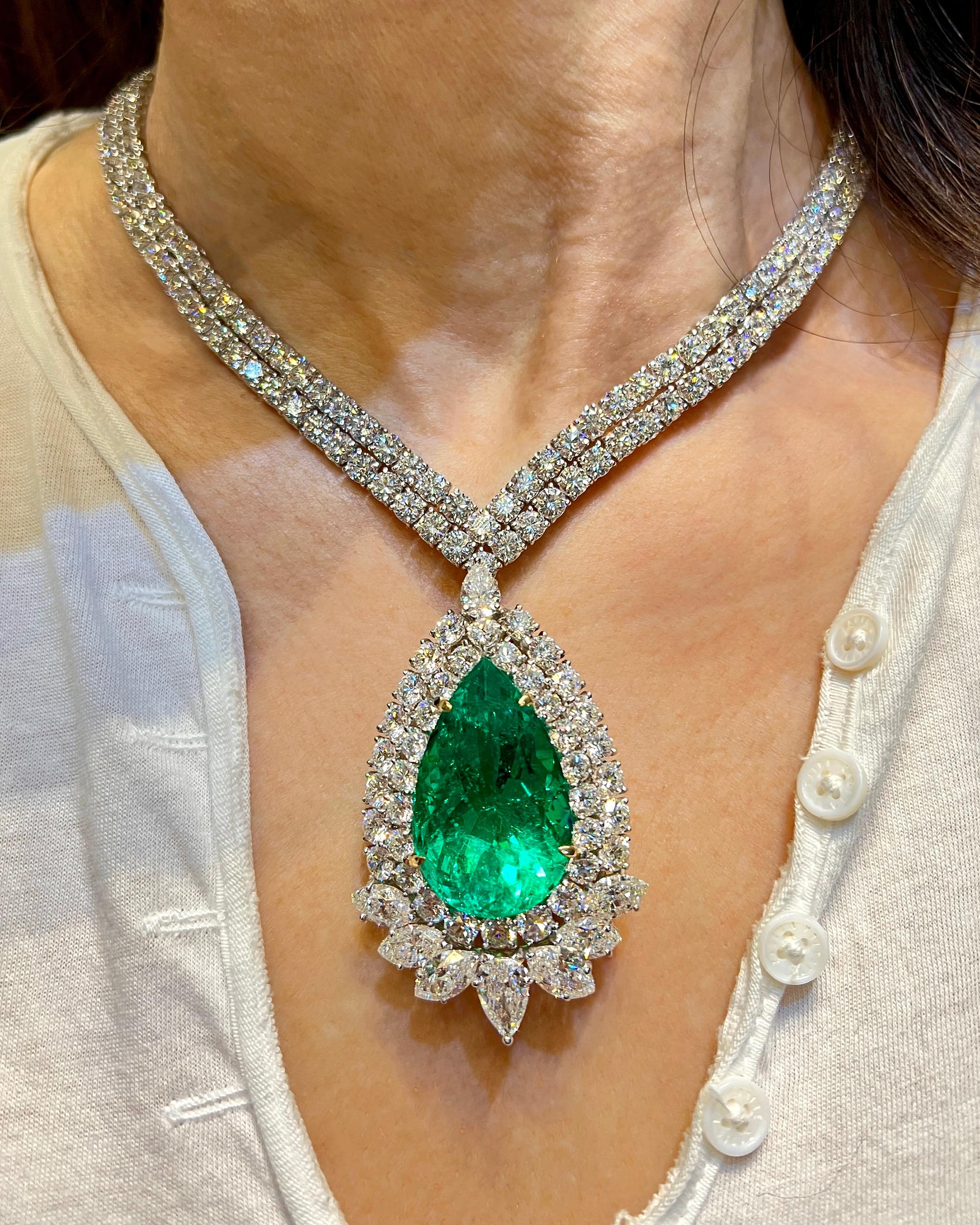 A breathtaking work of art, behold the glorious 47.76ct PS Colombian Emerald Pendant Diamond Necklace. This exquisite masterpiece exudes elegance and grace, capturing the essence of luxury and refinement.

At its heart lies a mesmerizing 47.76-carat