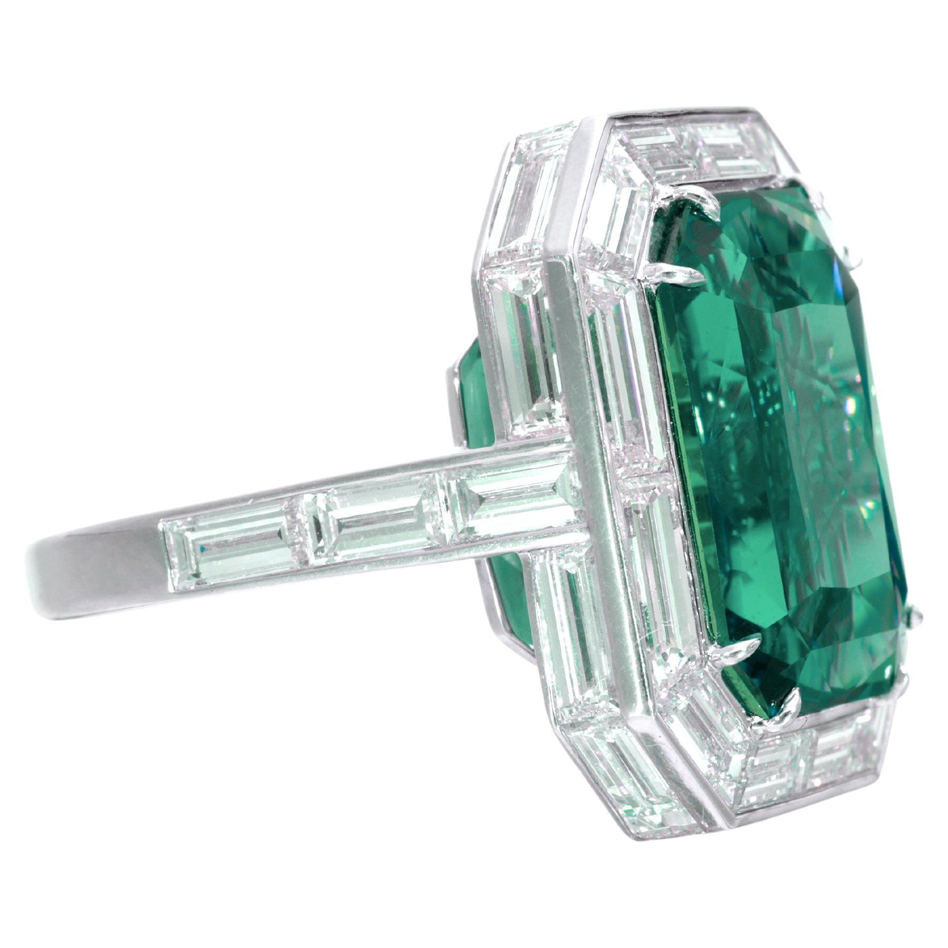 Introducing a truly extraordinary piece of fine jewelry: the AGL Certified 6 Carat vivid green emerald Diamond Ring.

Immerse yourself in the captivating allure of this exquisite ring, featuring a stunning 6 carat vivid green emerald of unparalleled