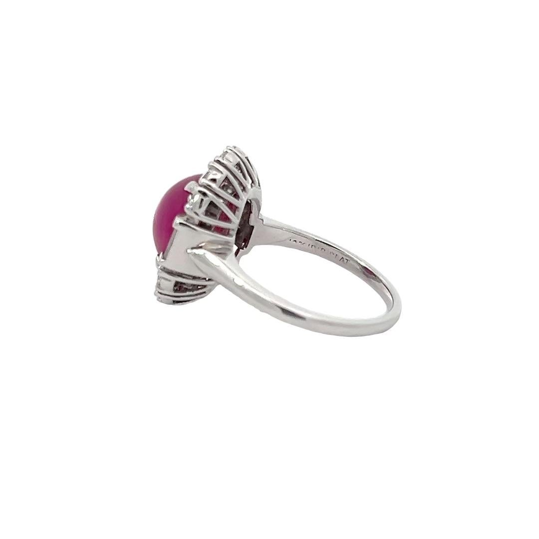 This Cabochon Ruby is a rare beauty. It is from Burma and has not been heat treated, unlike most rubies. This gem weights 6.05 carats, and is accompanied by a AGL certificate. Crafted in platinum, this ring also features 0.68 carats total weight of