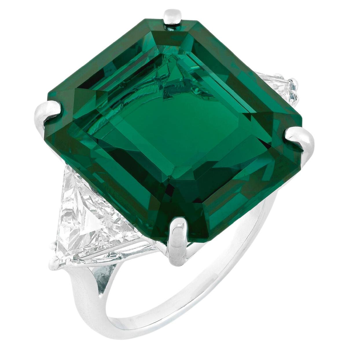 A SUPERB COLOMBIAN EMERALD AND DIAMOND RING, BY Cecile Blake
Emerald-shaped ruby of 6.25 carats, trapezoid cut diamonds that sum 1 carats set in solid platinum
f color vvs1 clarity diamonds

agl report Colombia minor oil