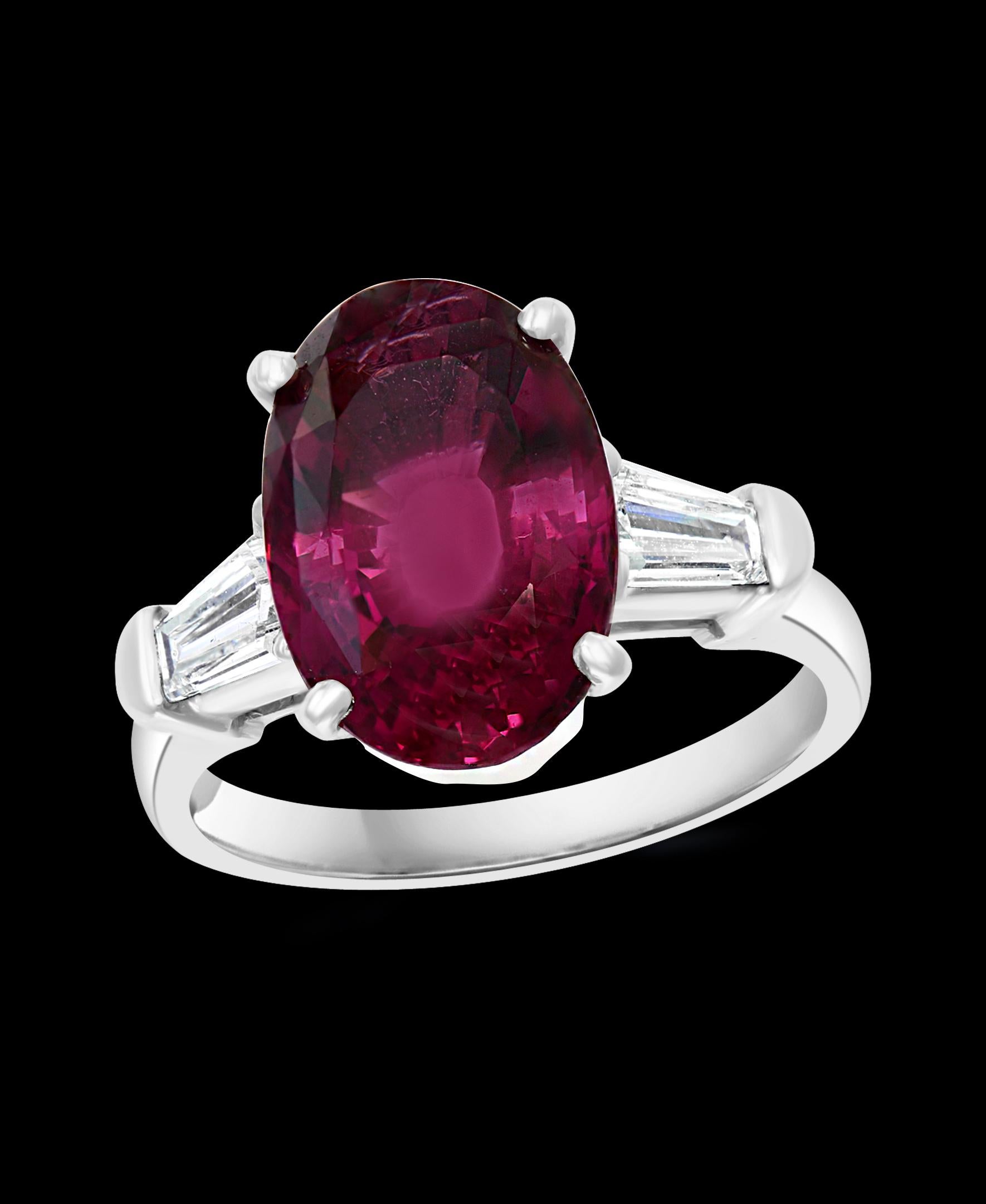 AGL Certified 6.5 Carat Oval Spinel and 0.6 Carat Diamond Ring Platinum, Estate
This spectacular Ring consisting of a single Oval Shape Spinel approximately  6.5 Carat.  The  Spinel   has one large baguettes diamond on each side of the oval Spinel.