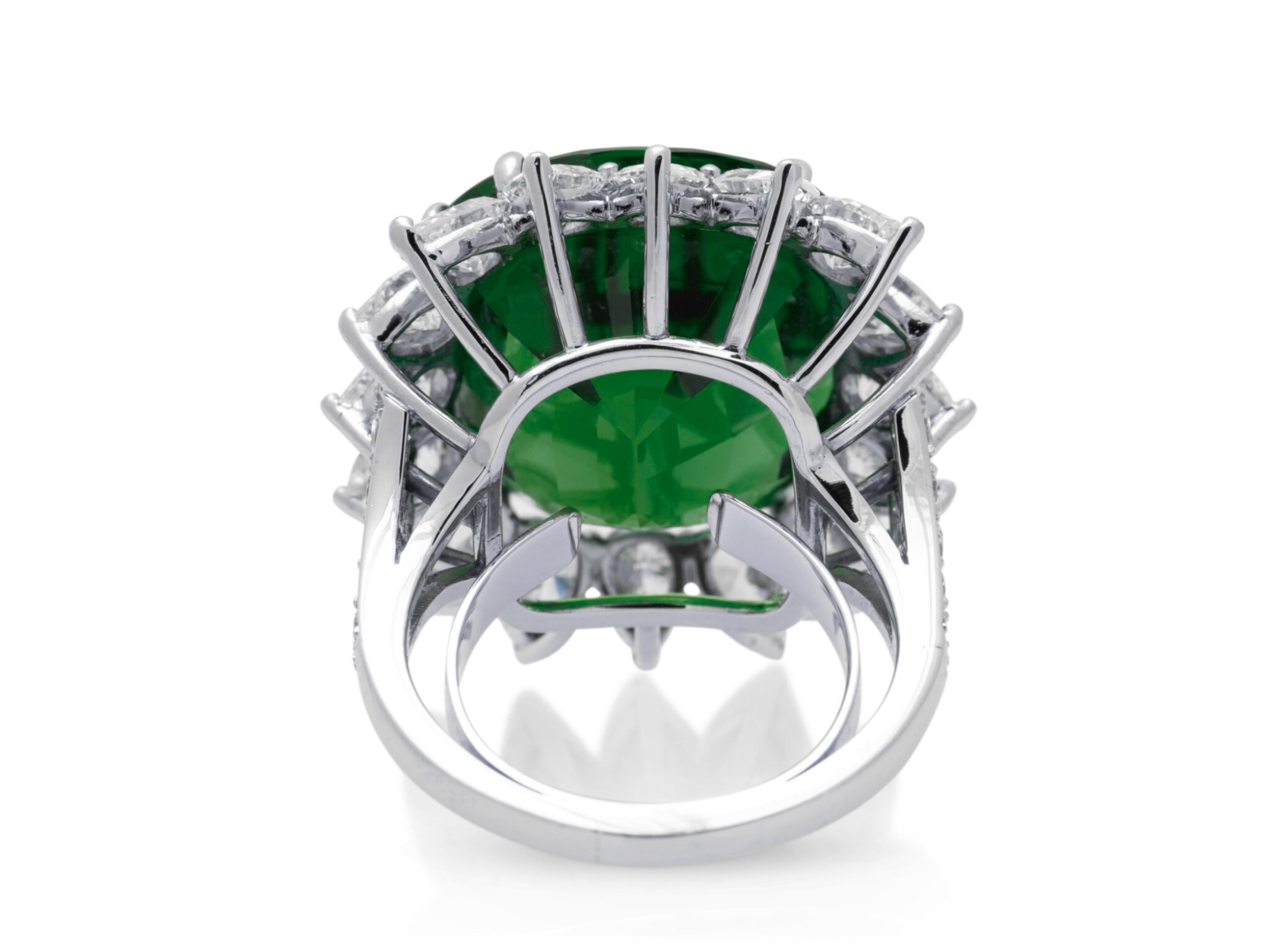 5.34-carat Colombian cushion emerald ring, beautifully set in luxurious platinum. This standout piece features a stunning high-quality emerald, known for its vibrant green color and brilliant clarity, certified by the prestigious