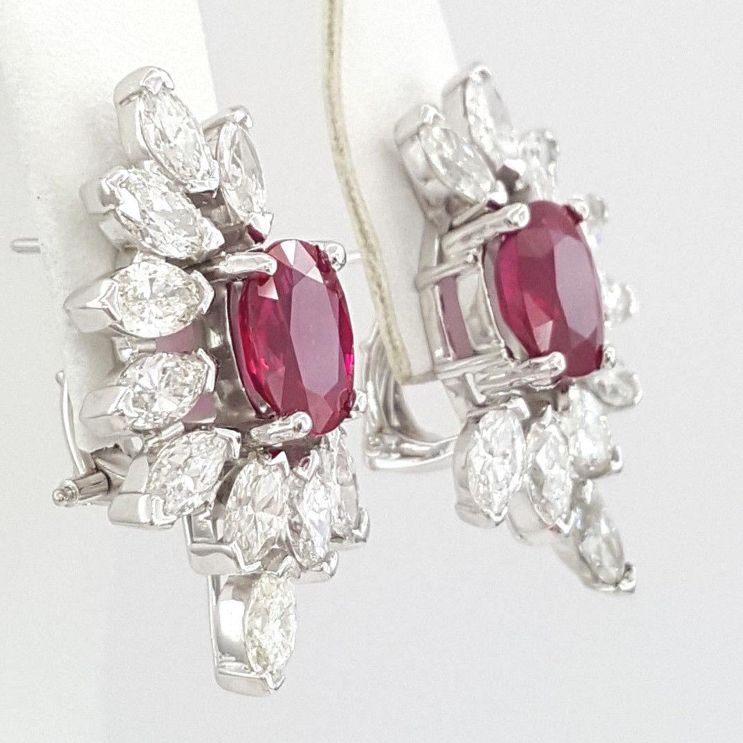These spectacular platinum earrings feature two beautiful oval Burma rubies mounted in solid platinum. 

The total weight of the rubies is 3.70 carats, and they are accompanied by an AGL report.

There are also 20 marquise diamonds mounted in