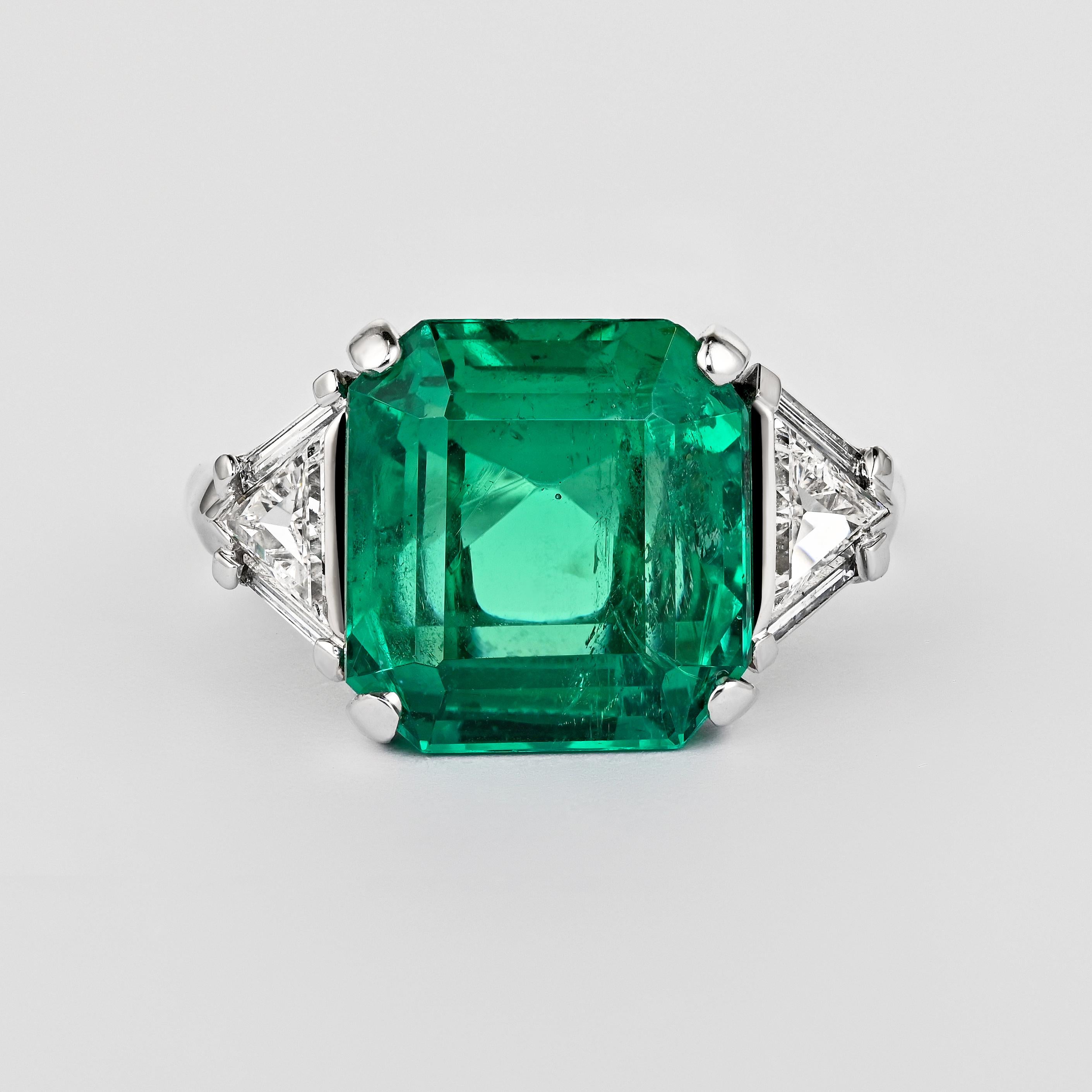 AGL Certified 8.01 Carat No Oil Colombian Emerald and Trillion Cut Diamond Vintage Platinum Ring. 

This Colombian Emerald stands out for its rich, vivid dark green color and excellent luster. It's exceptionally rare to find an emerald of this