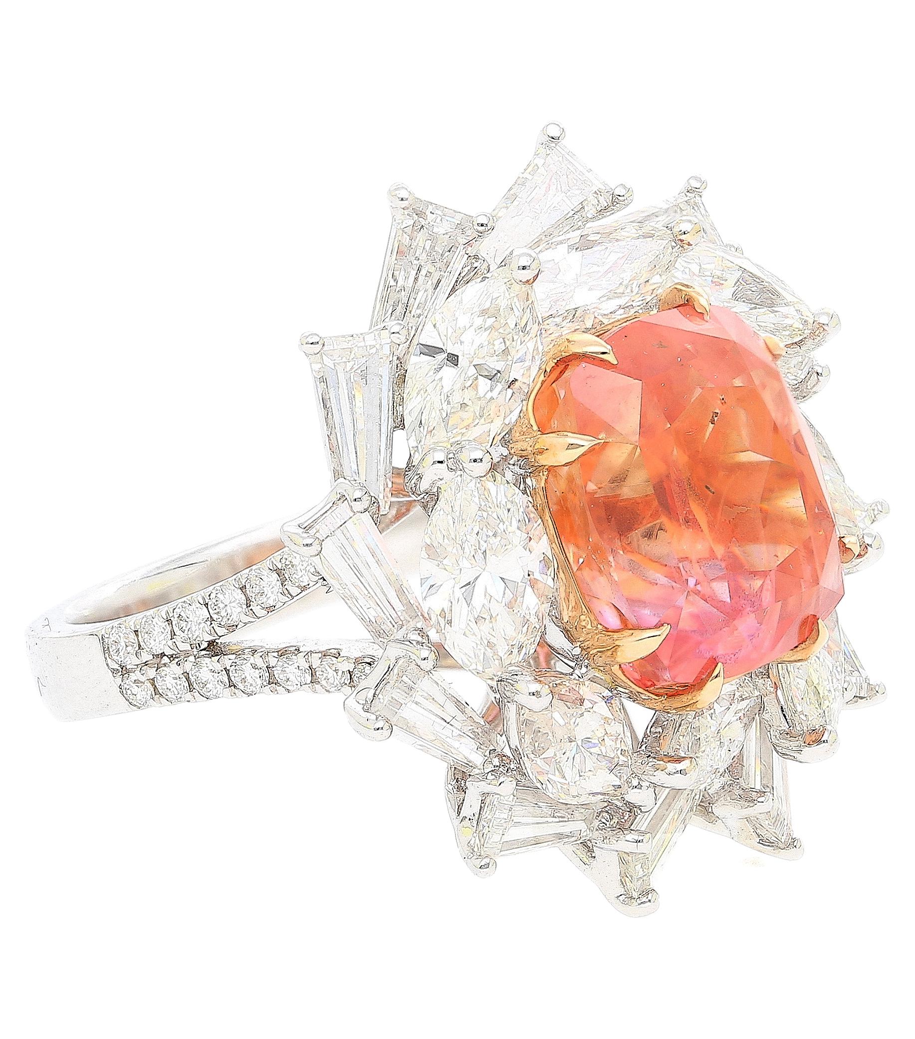 9.10 Carat cushion cut Ceylon no heat Padparadscha Sapphire and mixed cut diamond ring. Mounted in 18k white gold, set with 5.24 carats in marquise, trillion, and round cut diamonds. 

This incredible, extremely rare Sapphire is a true miracle of
