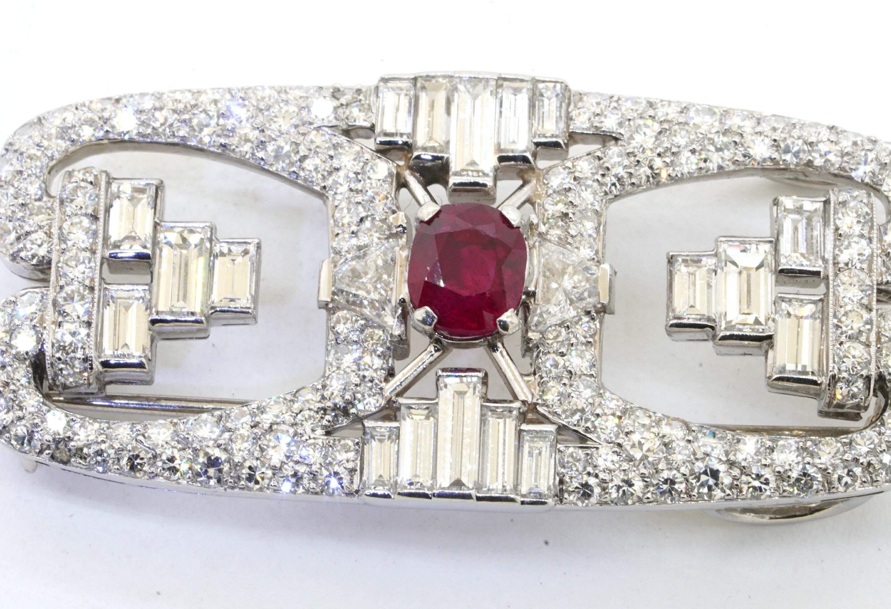 AGL certified antique platinum 9.29ct VS diamond No Heat Burma ruby brooch. This stunning brooch is made from solid platinum and features both diamond and ruby gemstones. The diamonds are both round and baguette cut and total approx. 8cts with the