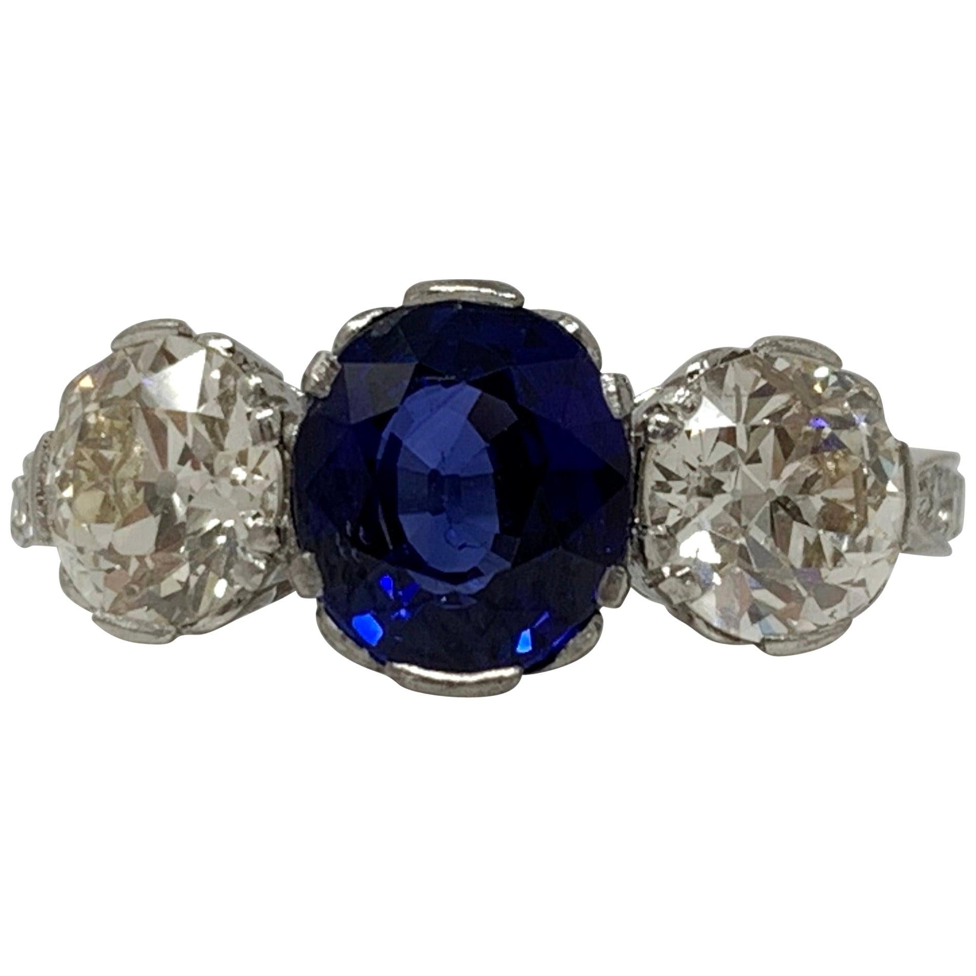 AGL Certified Blue Sapphire Oval Mixed Cut and White Diamond Three-Stone Ring For Sale