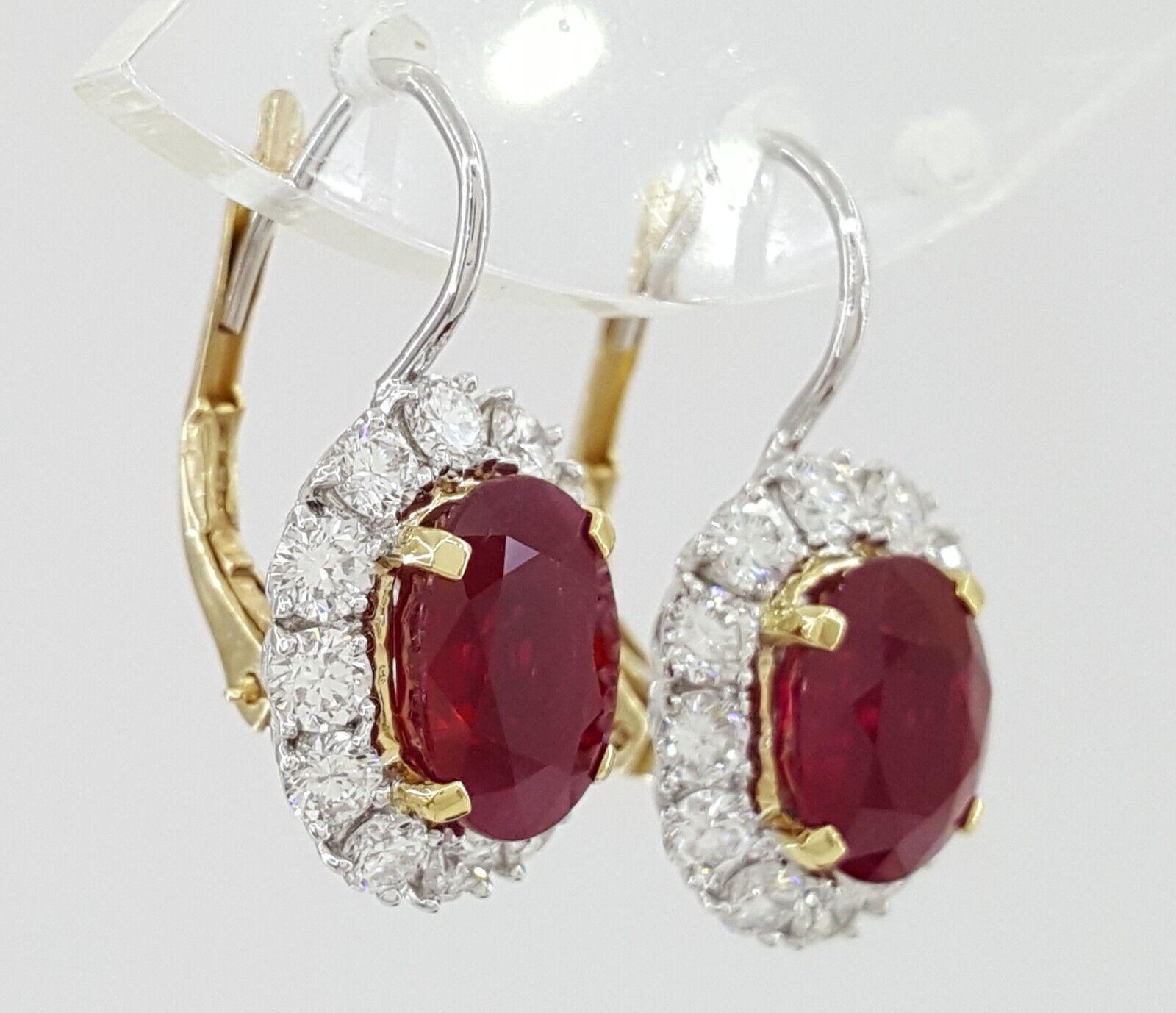 Experience unparalleled elegance with our exquisite 18K White & Yellow Gold Earrings, featuring a total weight of 6.55 ct of mesmerizing Natural Oval Cut Burma Pigeon Blood Rubies and sparkling Diamonds.
Admire the two Natural Oval Cut Vivid Pigeon