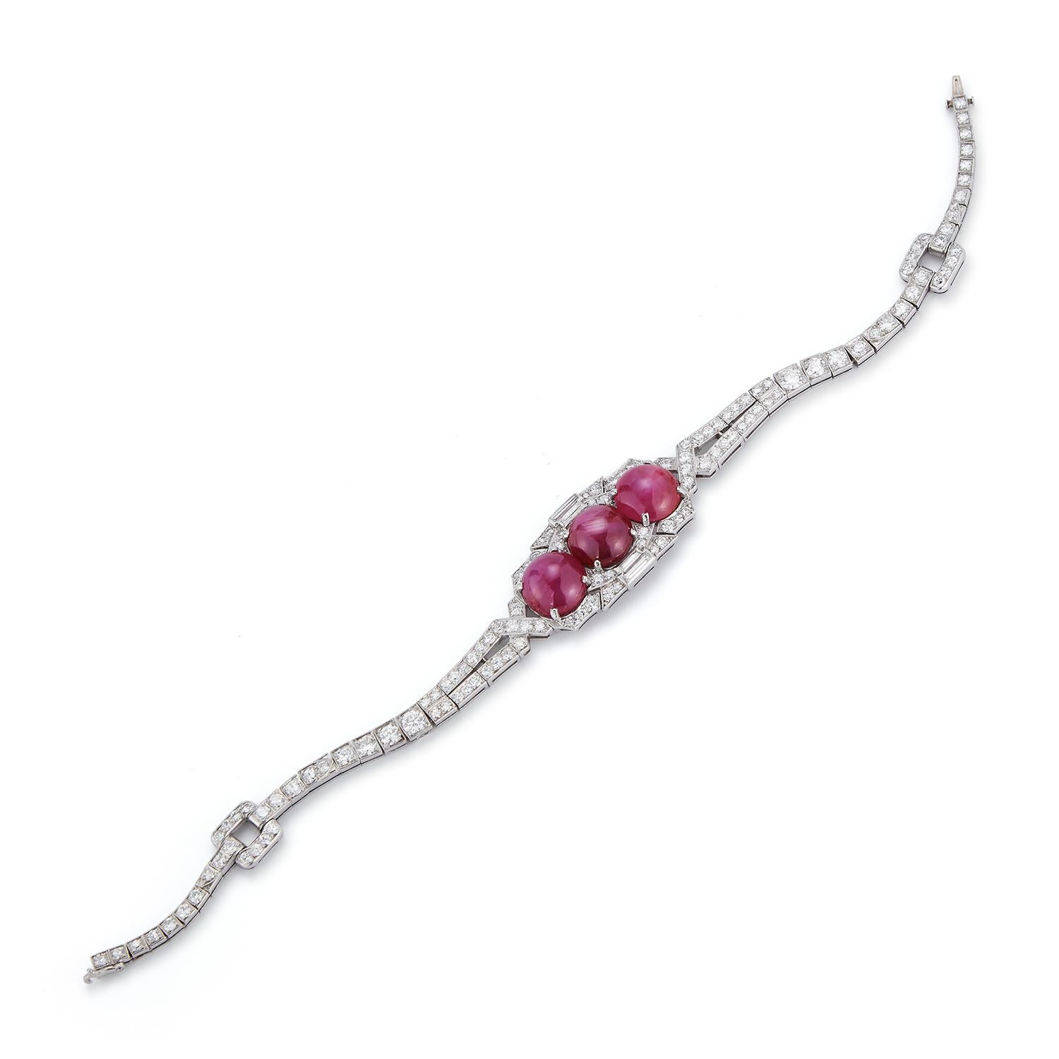 AGL Certified Cabochon Star Pink Sapphire and Diamond Art Deco Bracelet
3 cabochon star pink sapphire approximate Weight: 10.43 Carats 
4 baguette cut diamonds approximate Weight: .20 Carats 
130 round cut diamonds approximate Weight: 4.40 Carats