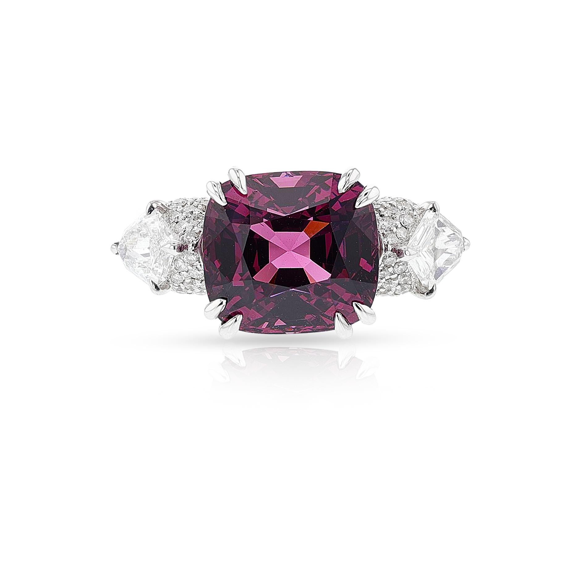 An AGL Certified Ceylon No Heat Purplish Pink Spinel and Diamond Ring made in 18k White Gold. The Ceylon No Heat Pink spinel AGL Certified weighs 10.33 carats, with by two kite-shaped diamonds weighing a total of approximately 1.00 carat, enhanced