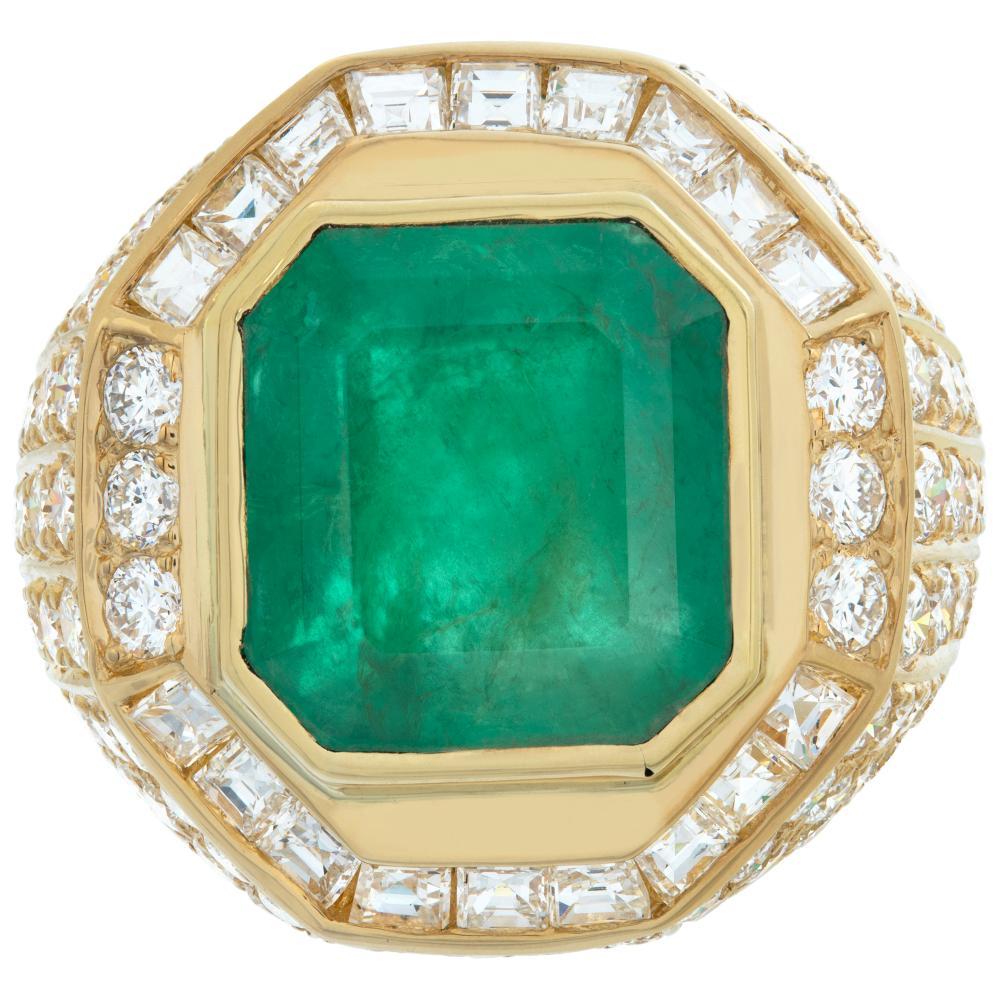 AGL certified, natural Colombian Emerald, 9.36 carats emerald cut shape, set in 18k yellow gold diamonds mounting, with approx total weight over 7.00 carats round brilliant and emerald cut diamonds, estiimate F-G color, VVS--VS clarity. Emerald has
