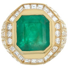 AGL certified Colombian Emerald emerald cut shape set in yellow gold diamonds