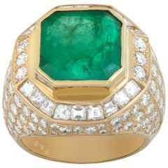 Vintage AGL certified Colombian Emerald emerald cut shape set in yellow gold diamonds