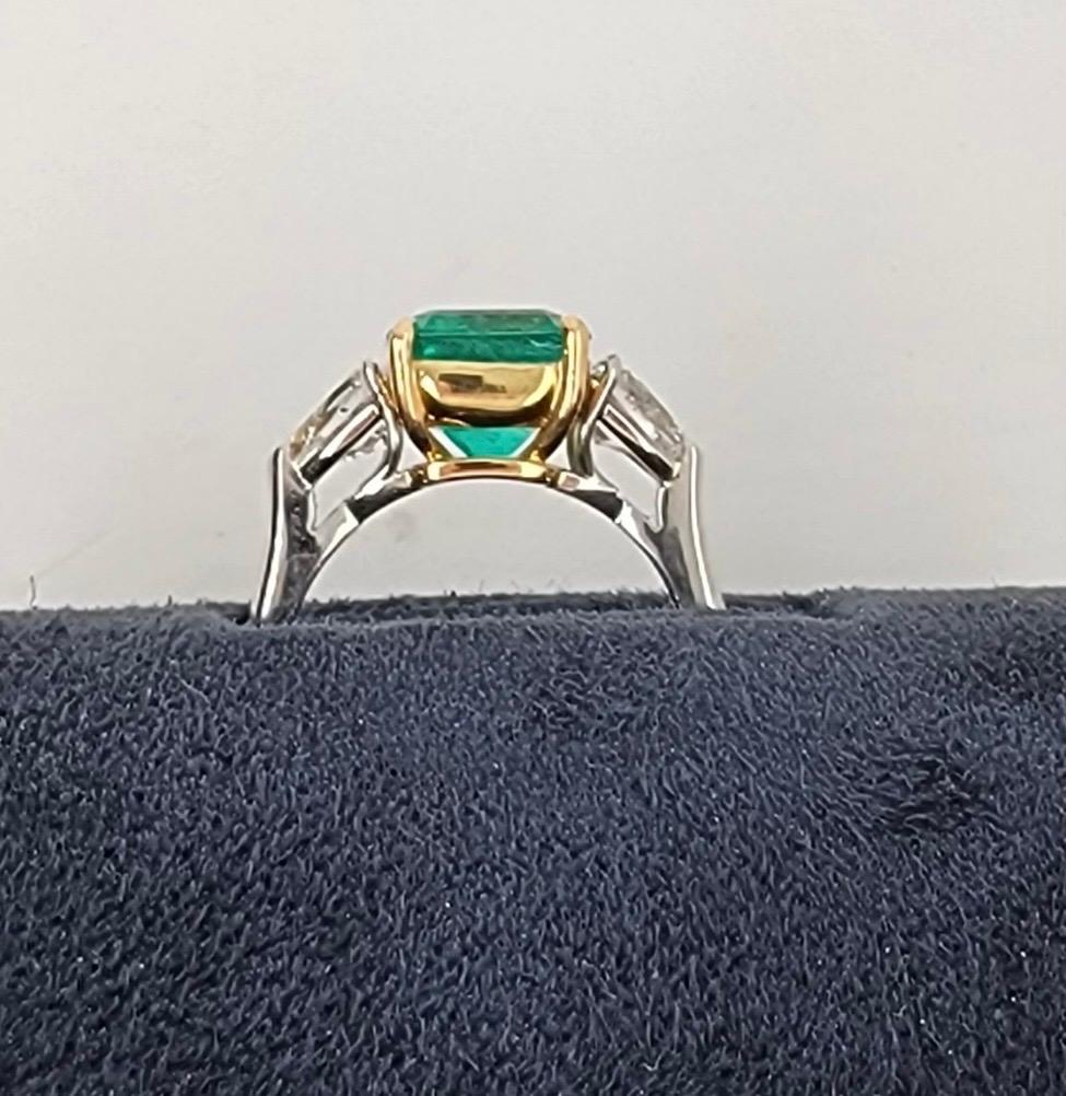 
Beautiful 2.90 carat gem, Colombian natural AGL certified emerald, set with two colorless triangle step cut diamonds. This highly coveted ring is set in 18k gold and is a beautiful example of what a gem emerald shud look like. 
