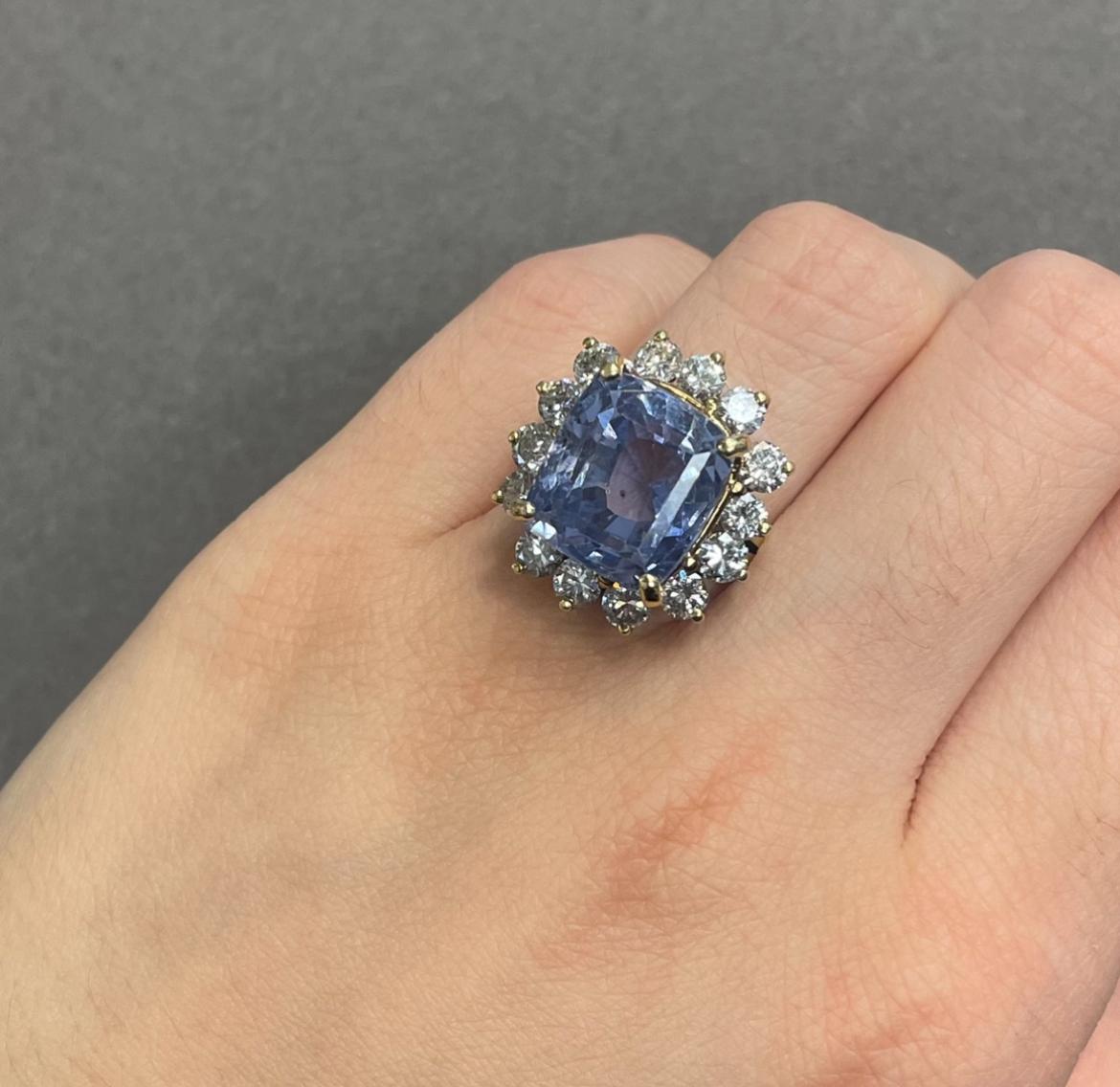 AGl Certified Cushion Sapphire and Diamond Cocktail Ring

A yellow gold ring set with a cushion sapphire adorned with a diamond halo

Sapphire Weight: 19.19 carats
Approximate Diamond Weight: 2.38 carats

Accompanied by an AGL report stating the