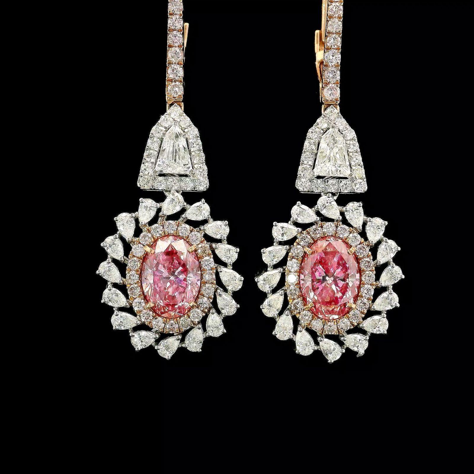 8kt white gold earrings with diamonds
  
  Gold colour & karat: White gold 18kt
  Weight: 9.50 grams
  
  Set with-
  Stone type: Diamonds
  Shape: Oval
  Carat: 1.50 ct, 1.40 ct
  Colour: Fancy Pink / Fancy Pink 
  Clarity: VS, VS
  
  Surrounding
