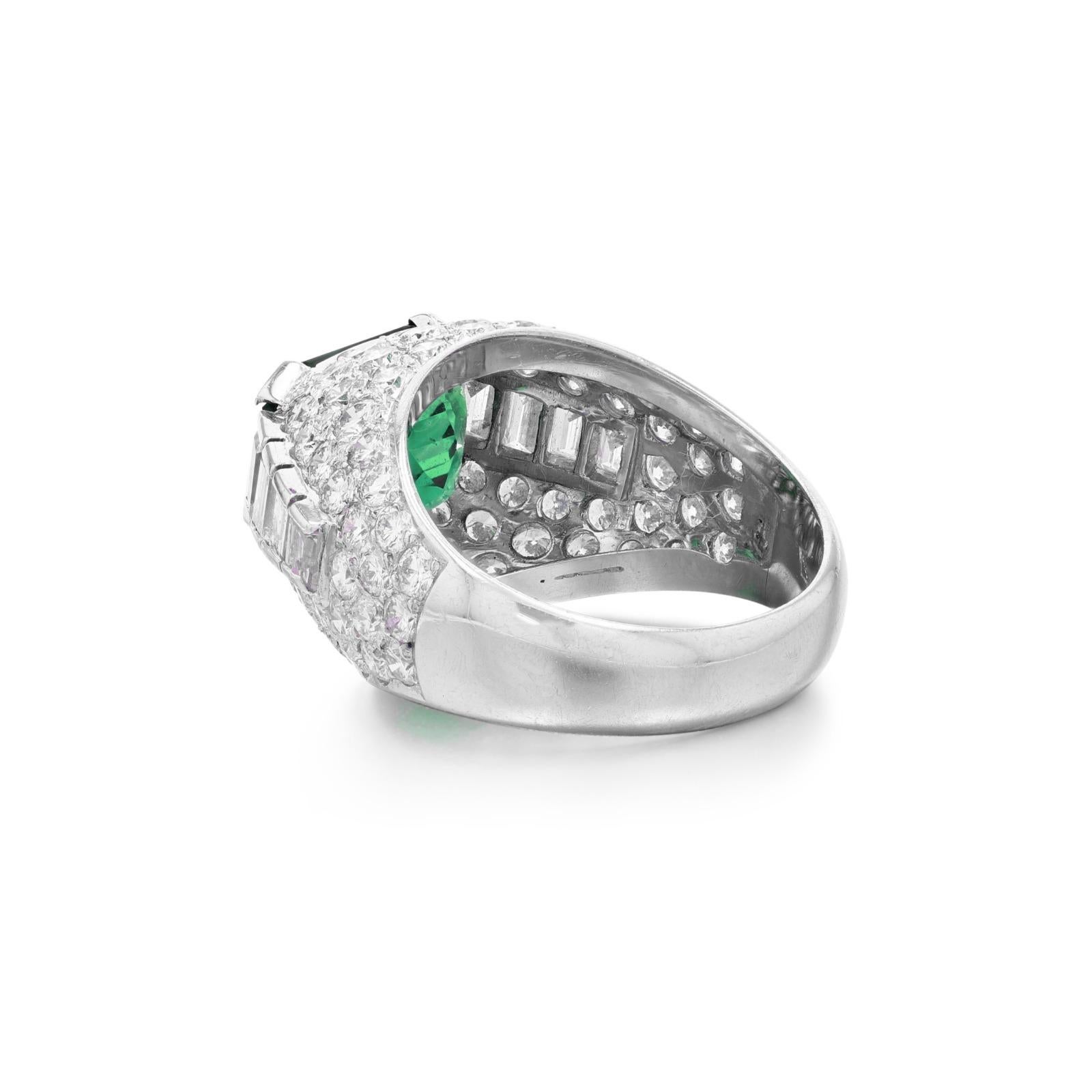 an extraordinary piece featuring a stunning 6-carat emerald cut green colombian emerald beautifully set in platinum. This captivating emerald certified by AGL, is known for its exceptional quality as a colombian emeralds have natural brilliance and