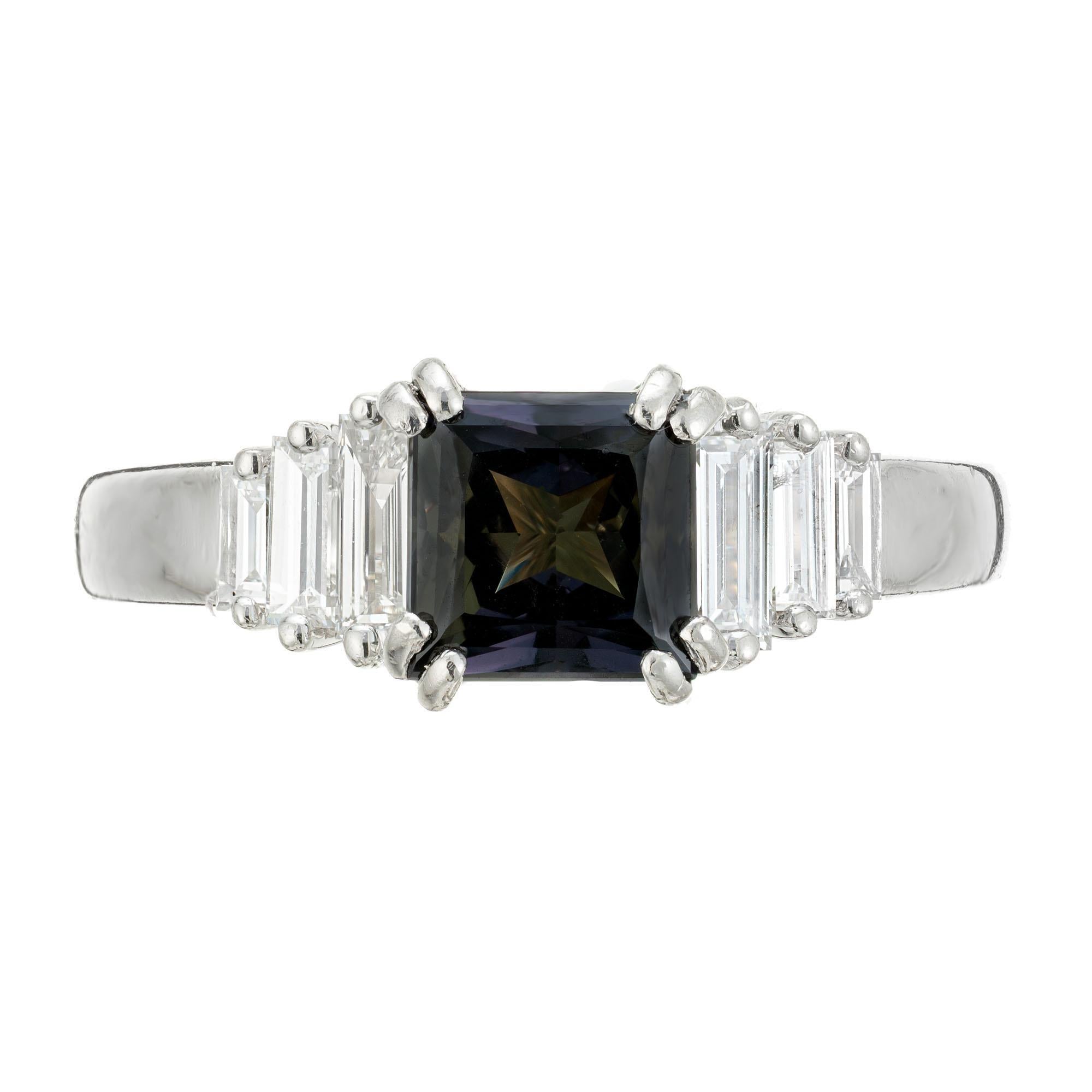 Sapphire and diamond engagement ring. AGL certified center green sapphire set in a platinum setting with 6 straight graduated baguette diamonds. Circa 1950-1960

1 natural brownish green square Sapphire approx. total weight 1.41cts AGL certificate #