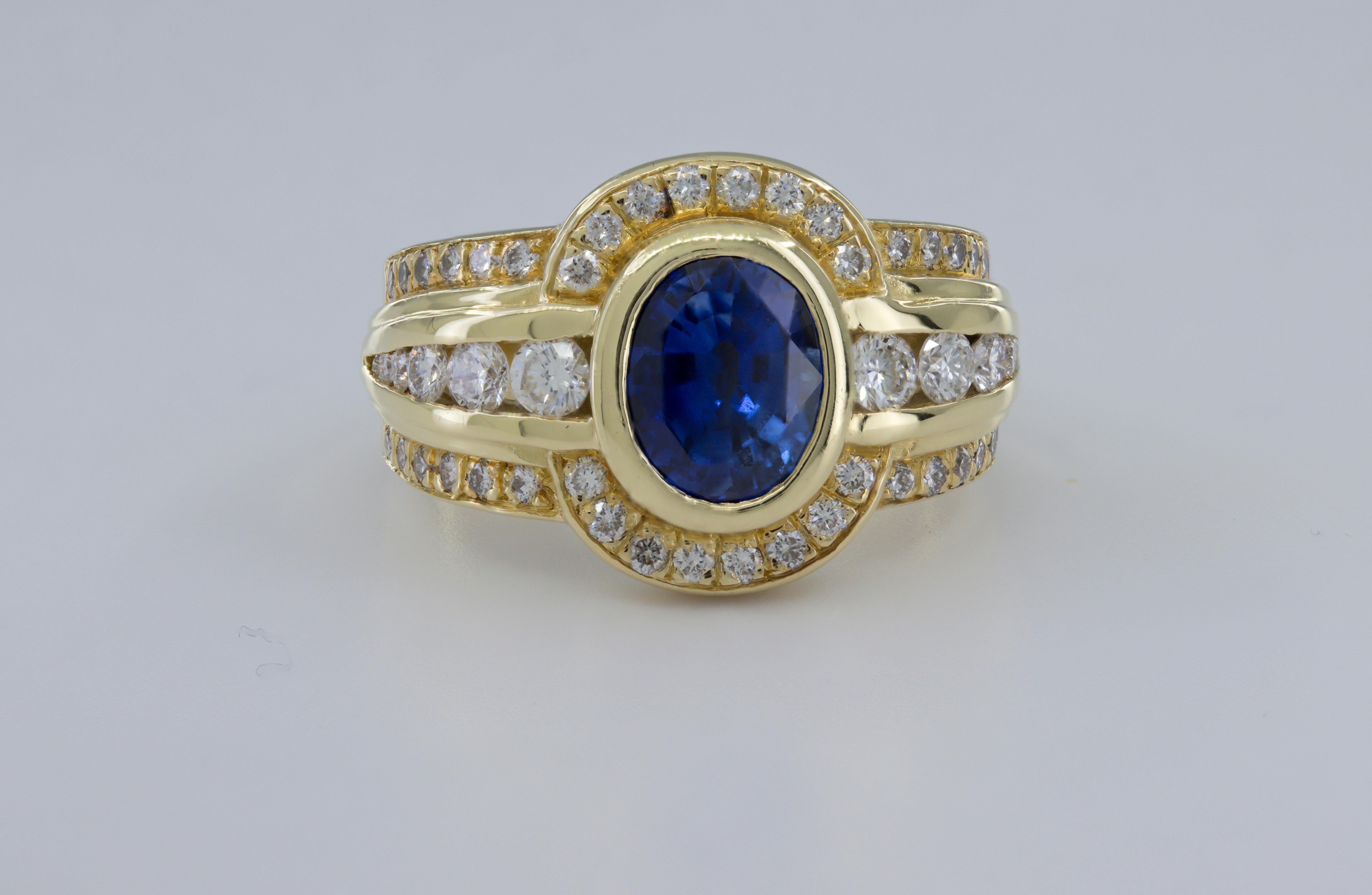 Featuring (1) oval-cut deep blue sapphire, 2.20 cts., accompanied with an AGL Report 1132085, dated 2 June 2023, stating Madagascar origin and heated, accented by (64) full-cut diamonds, 1.00 ct., tw., VS, G-H, bezel, channel, and bead set in an 18k