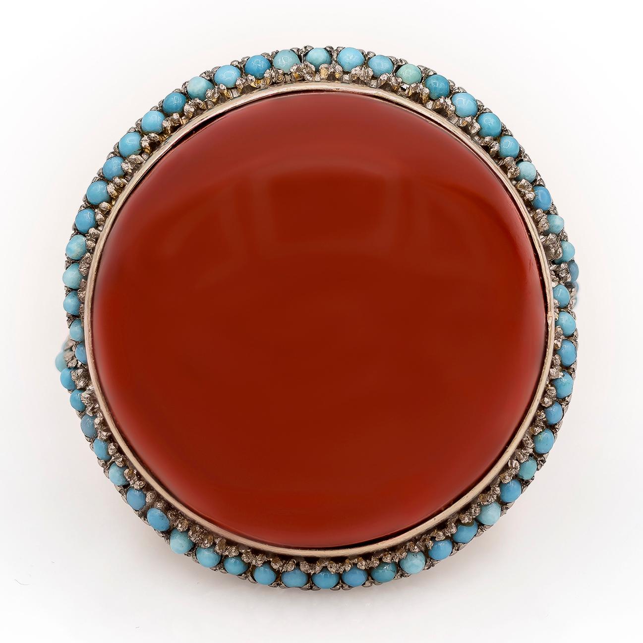 Antique ring showcasing a natural and rare cabochon red coral also known as 