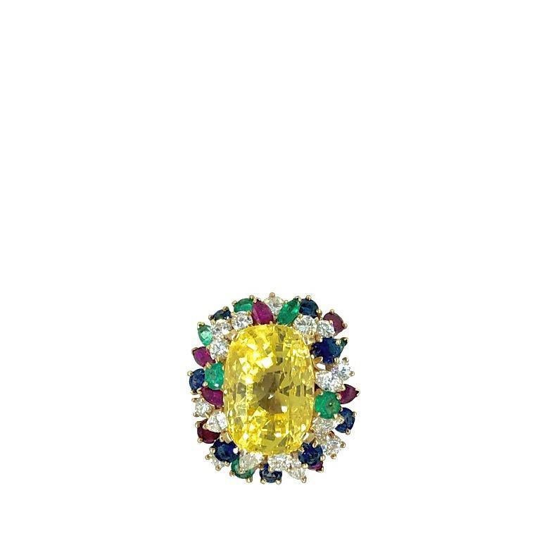 Outstanding 1960’s Natural no heat yellow sapphire ring from Oscar Heyman. The approximately 33 carat yellow sapphire is surrounded by 2.50 cts in diamonds and 4 carats in combined Sapphires, Emeralds and Rubies. Mounted in 18K yellow gold.
Signed