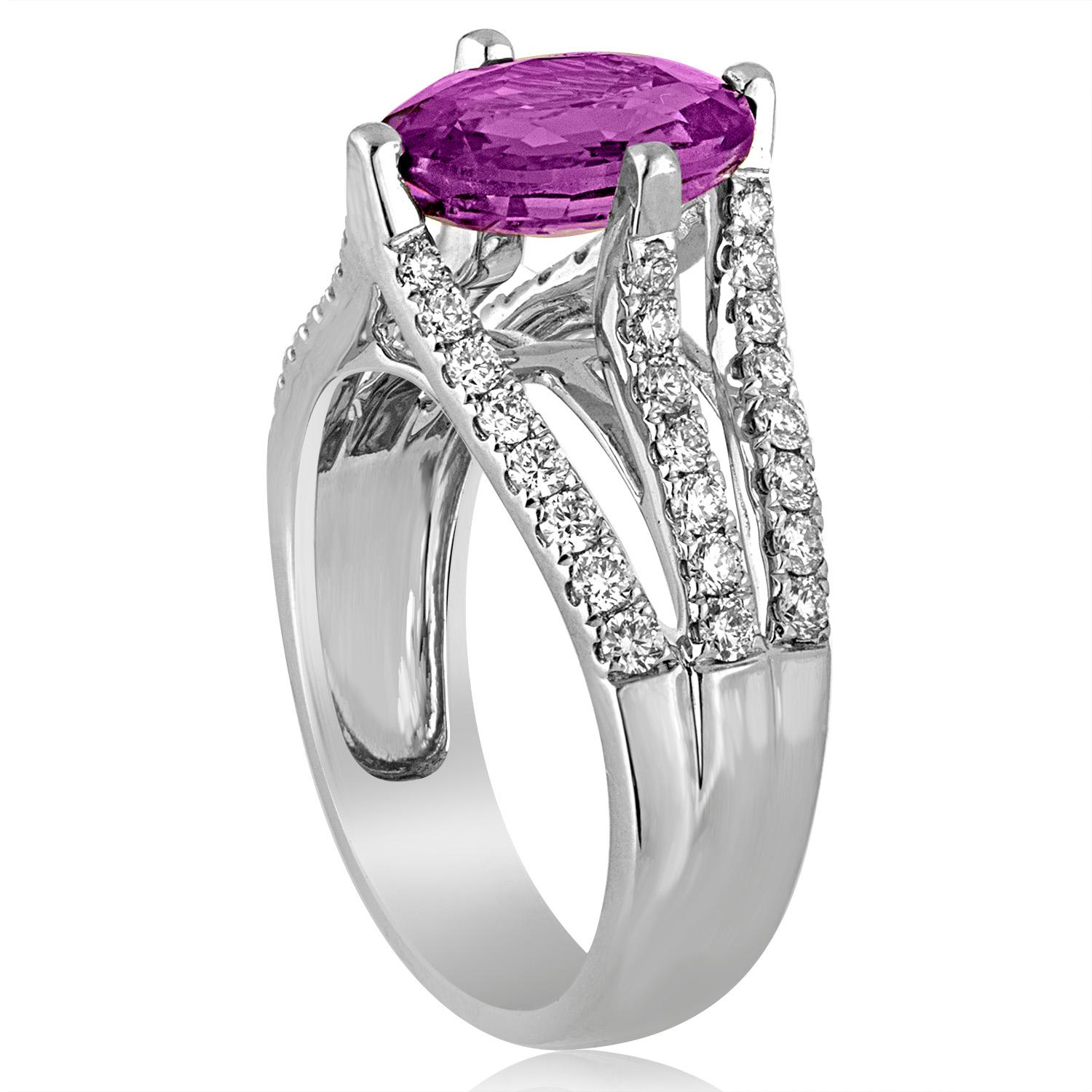 Very Stunning Sapphire Ring
The ring is 18K White Gold
The center stone is an Oval 2.86 Carat Purple Pink Sapphire
The sapphire has NO HEAT and is certified by AGL.
There are 0.60 Carats in Diamonds F VS
The ring is a size 5.75, sizable.
The ring