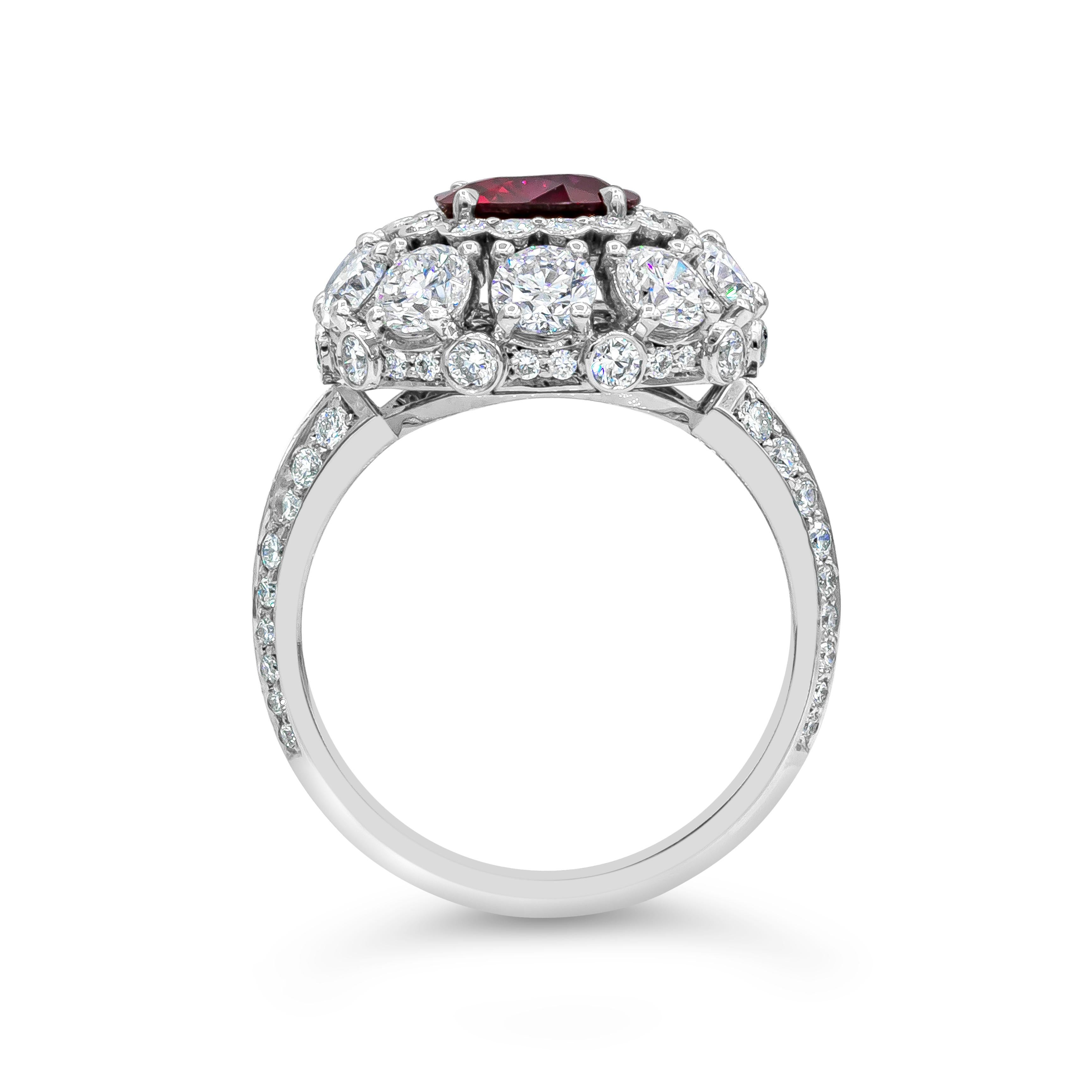A beautiful halo engagement ring style showcasing a 1.69 carats color-rich red cushion cut ruby certified by AGL as Burmese Origin with no indications of heat treatment. Set in a handcrafted, intricately-designed halo mounting accented with round