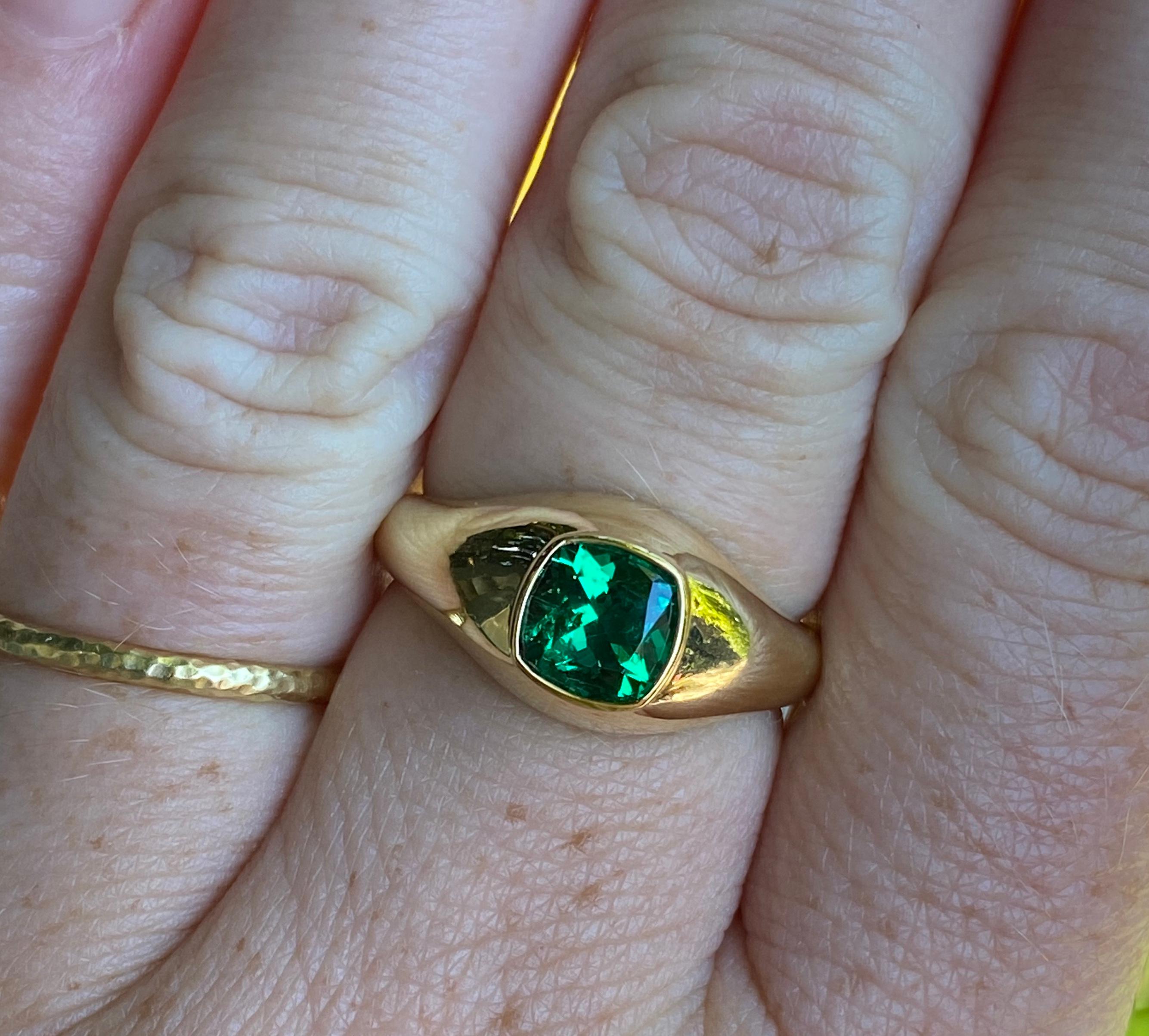 This ring features a gem quality 1.07 alpine green Colombian emerald that is certified by AGL as having no treatment. It is set in our hand carved wax/cast signet of 18 karat recycled gold by our master goldsmith. His or hers. An investment
