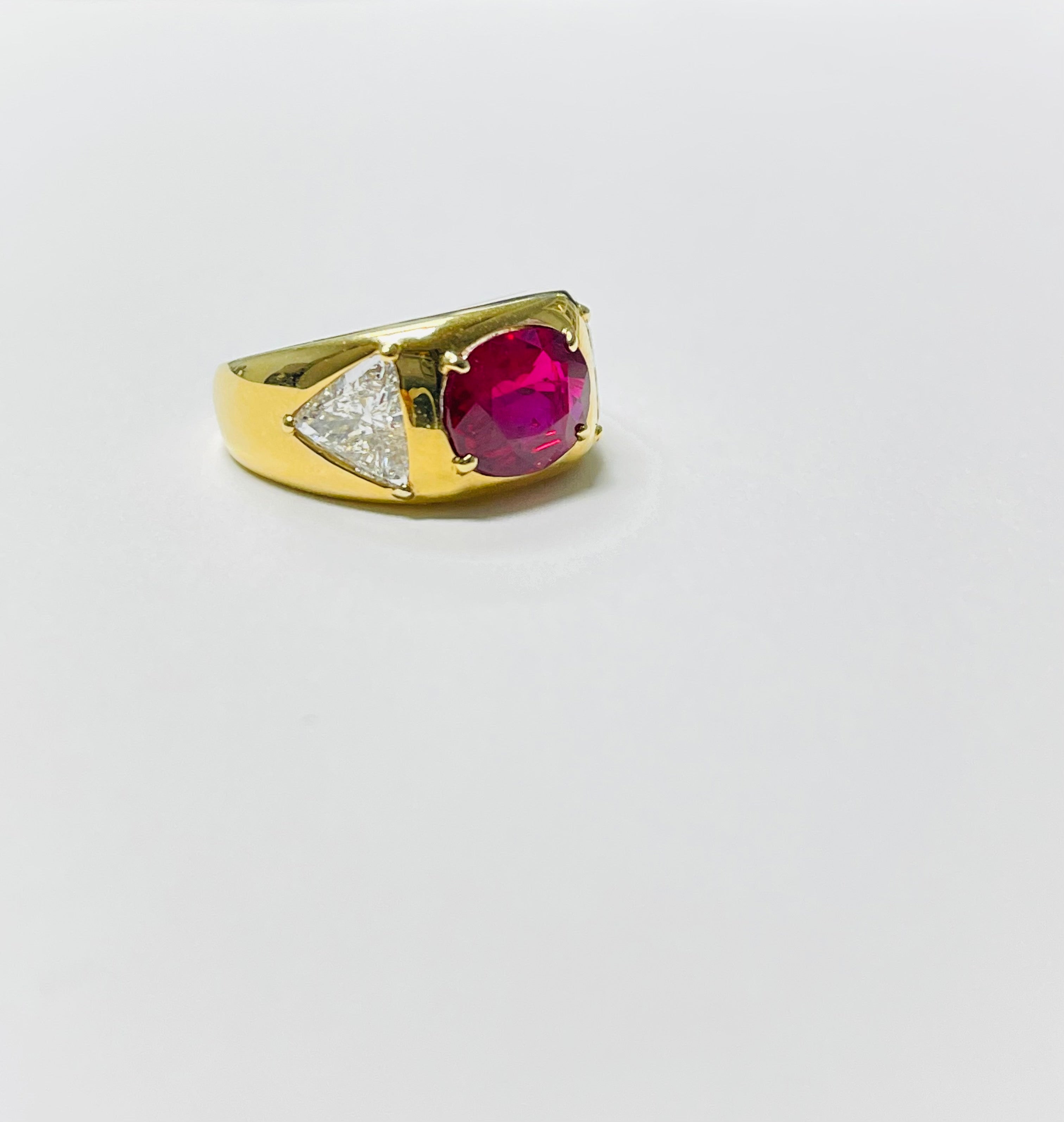 Contemporary AGL Certified Oval Ruby and Trillion Diamond Engagement Ring in 18K Yellow Gold For Sale