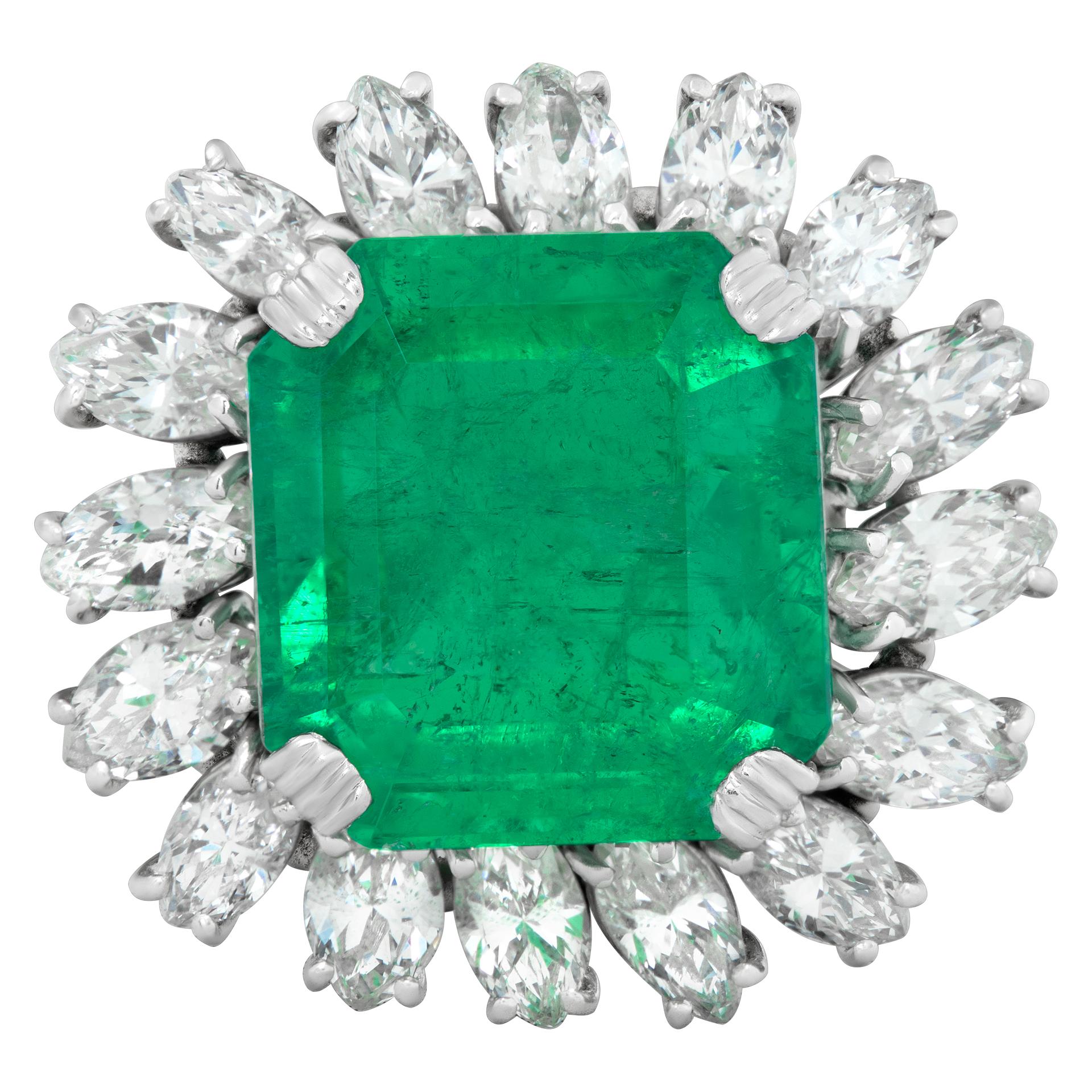 AGL certified over 8 carat Colombian emerald ring in a platinum setting with over 3 carats in G-H color VS-SI clarity marquise diamonds. Size 8.This Diamond/Emerald ring is currently size 8 and some items can be sized up or down, please ask! It