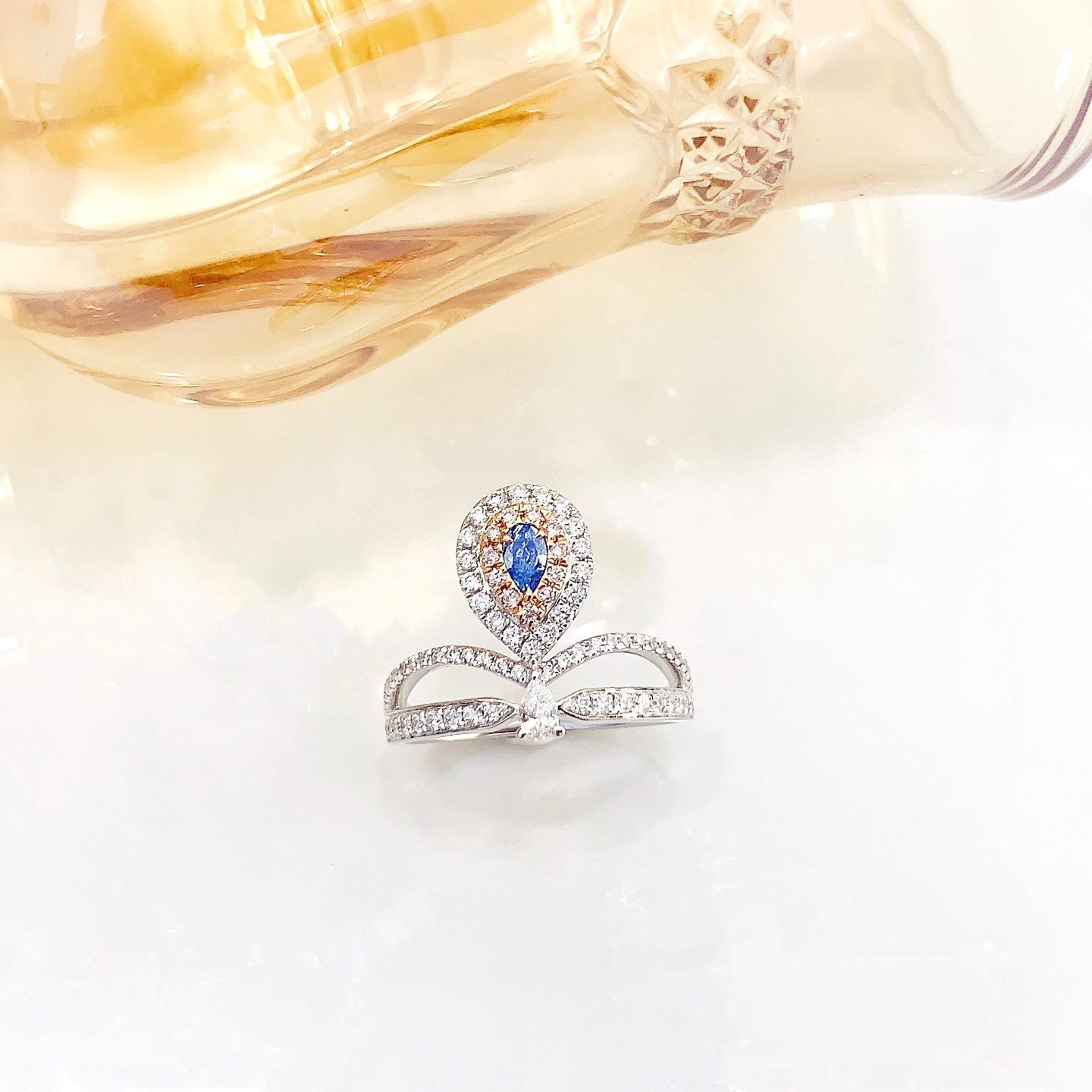 AGL Certified Pear-Cut Blue Diamond 18K Gold Ring with Diamonds

1 Pear-Cut Blue Diamond - 0.10 CT
Diamonds - 0.46 CT

Total Weight - 3.43 GM

AGL Certification Attached