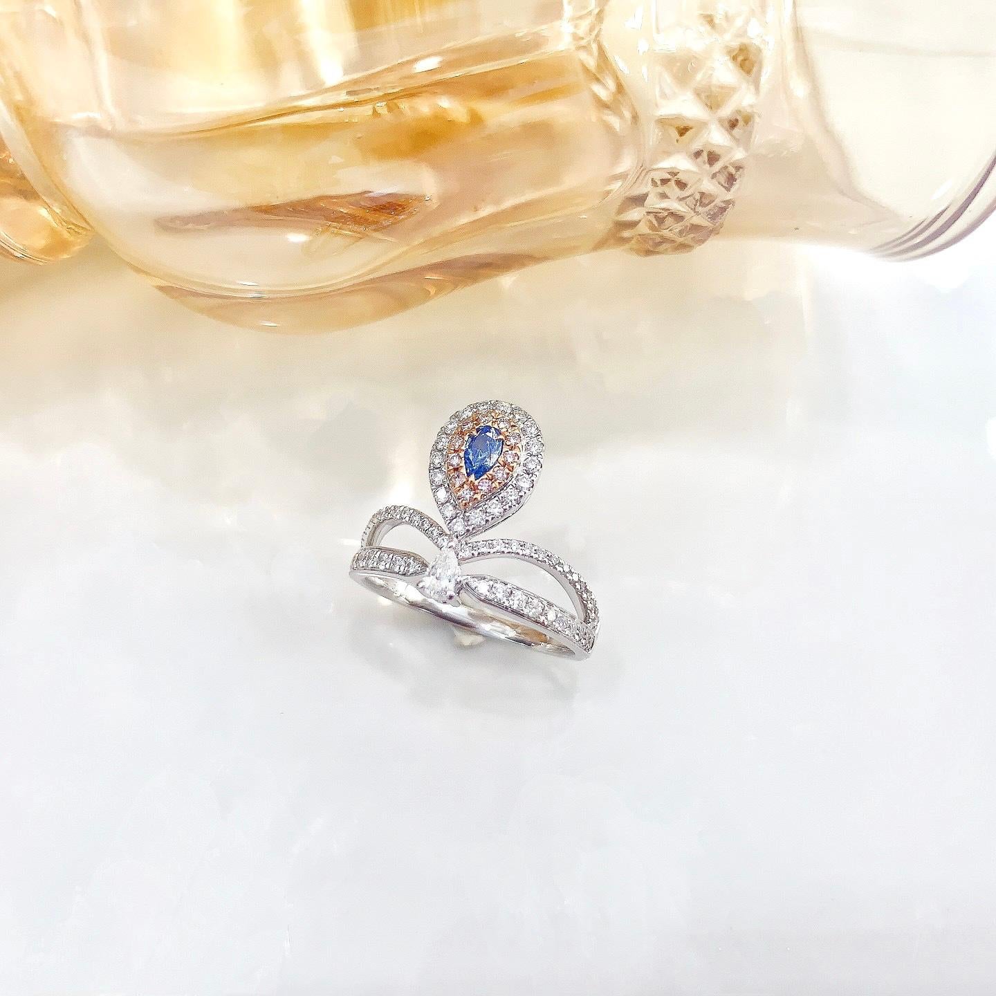 Pear Cut AGL Certified Pear-Cut Blue Diamond 18K Gold Ring with Diamonds For Sale