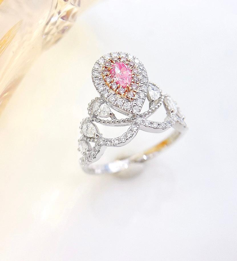 AGL Certified Pear-Cut Pink Diamond 18K White Gold Ring with Diamonds

1 Pear-Cut Pink Diamond - 0.23 CT
AGL Certification Attached

Diamonds - 0.70 CT

Total Weight - 3.95 GM