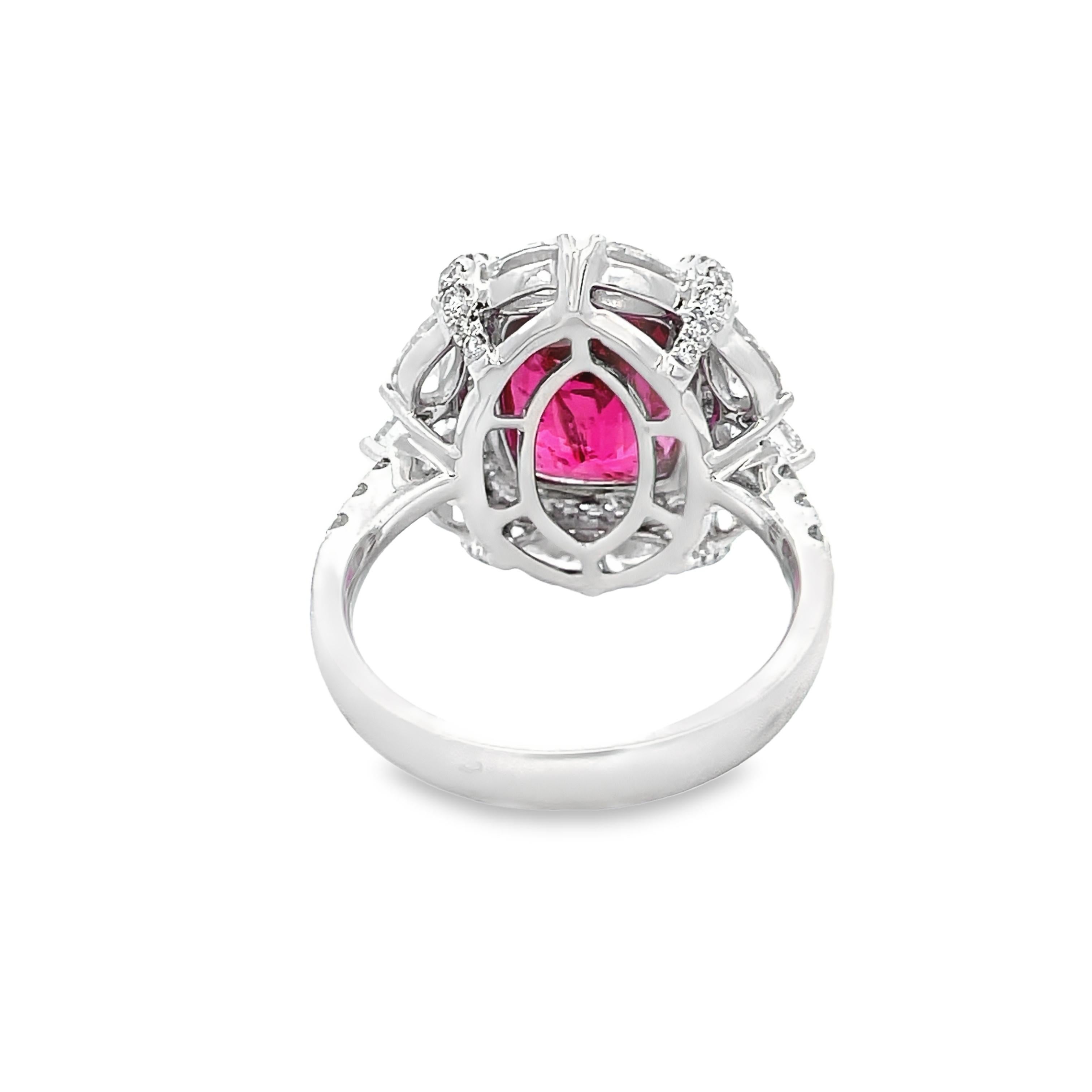 Discover unparalleled beauty with our AGL certified 6.07 carat pink sapphire cushion and 2.23 carat white diamond (mixed shape) 18KW ring. This exquisite piece captures attention with its vibrant pink sapphire centerpiece, certified by AGL for