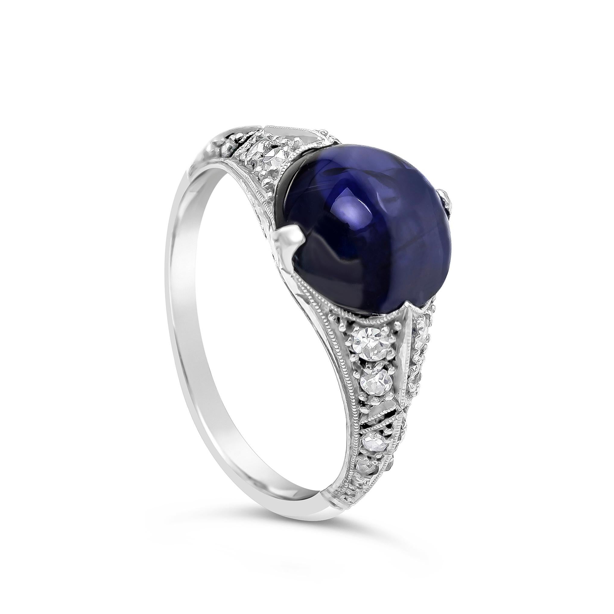 A gorgeous fashion ring, featuring a 4.20 carats cabochon blue sapphire certified by GIA as natural, set on an antique art deco style. Accented by round cut diamonds weighing 0.22 carat total, set on a half-way setting. Finely made with a platinum