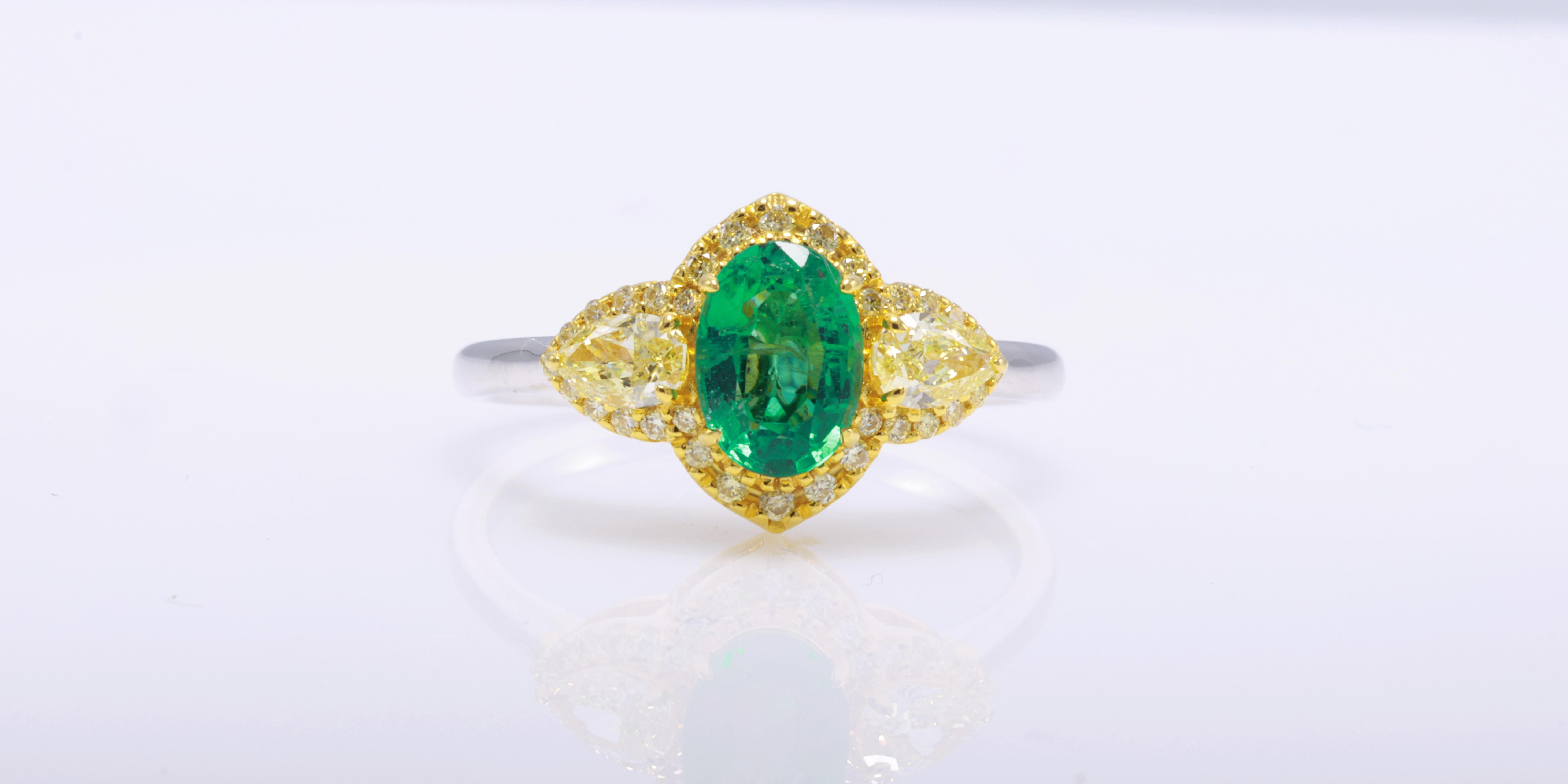 18kt white gold ring with diamonds
  
  Gold colour & karat: White gold 18kt
  Weight: 3.244 grams
  
  Set with-
  Stone type: Diamond
  Shape: Oval
  Carat: 0.823 
  Colour: Vivid Green
  Clarity: -
  
  Surrounding Stones: Diamonds
 1) Side Pear