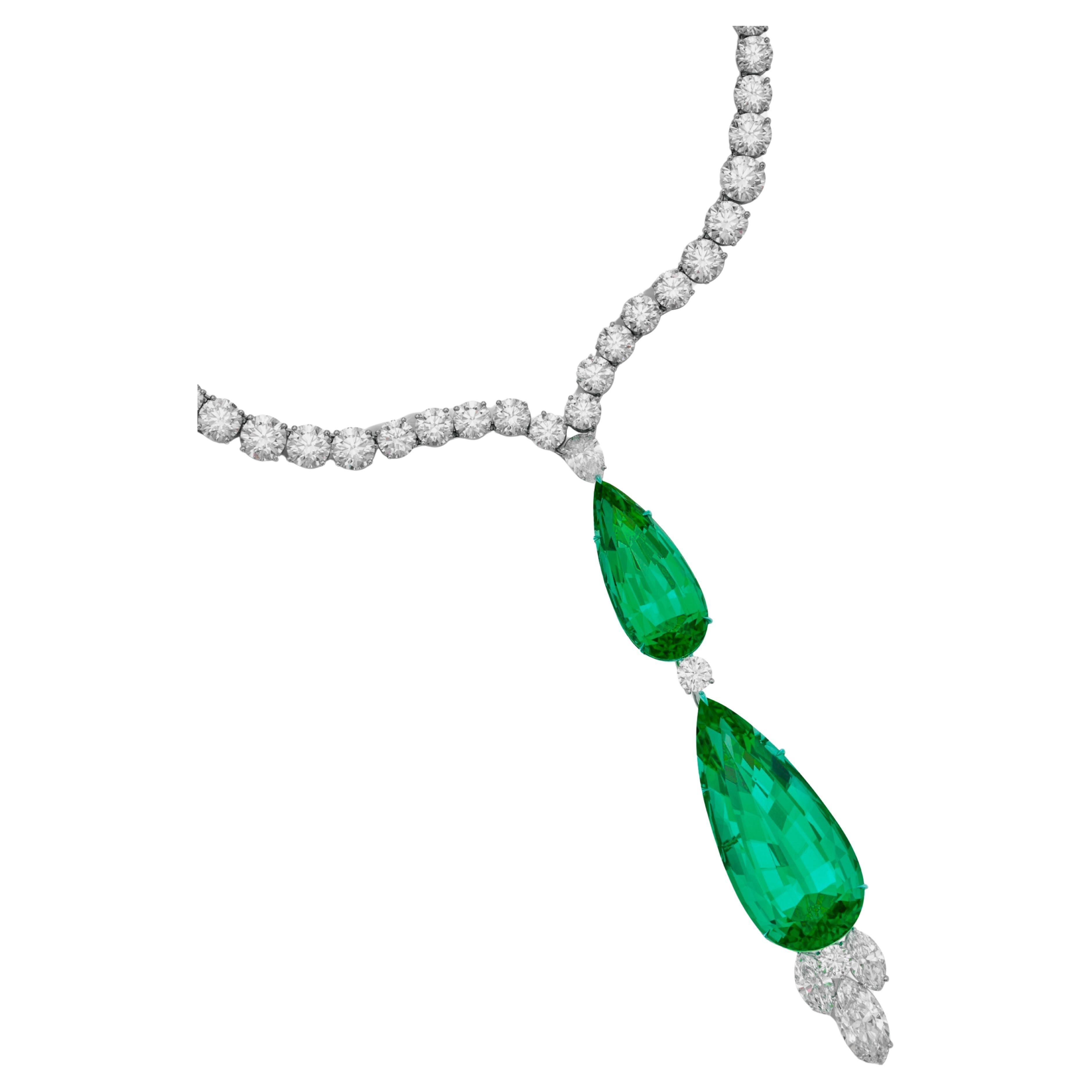 Emerald and Diamond 'Royal Gardens' Pendant-Necklace features two stunning emeralds that are each certified by respected gemological laboratories, AGL (American Gemological Laboratories) and GRS (GemResearch Swisslab).

One emerald weighs 15.43
