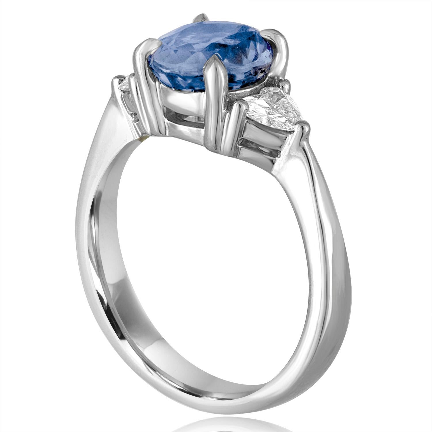 Beautifully Classic Three-Stone Ring
The ring is 18K White Gold
There 0.40 Carats in Diamonds G/H SI1/SI2.
The center stone is an oval 2.44 Carat Blue Sapphire
The Sapphire is NO HEAT and is certified by AGL.
The ring is IGI certified.
The ring is a