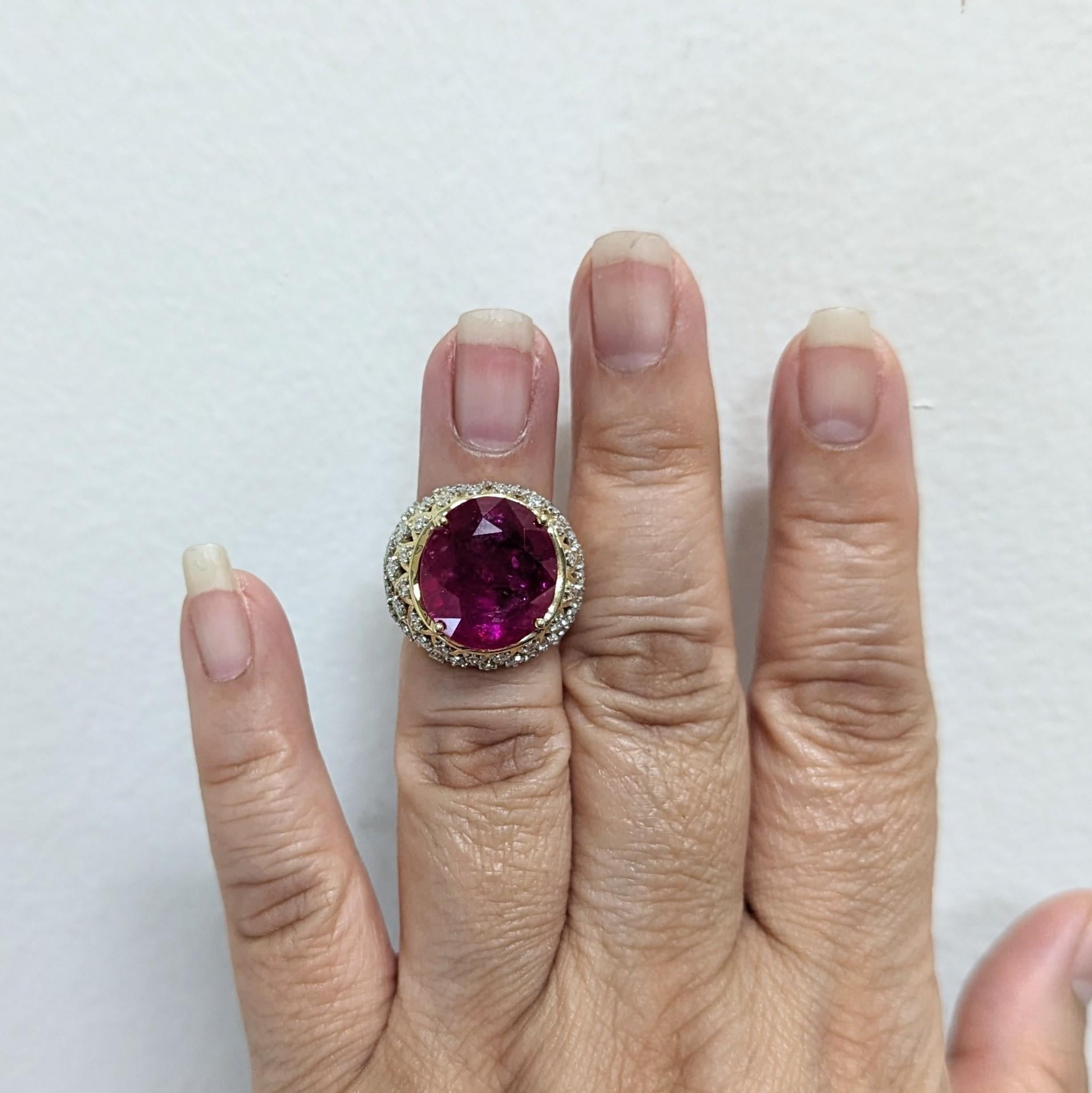 Gorgeous 16.41 ct. Mozambique ruby oval with good quality white diamond rounds.  Handmade in 18k yellow gold.  Ring size 4.25.  AGL certificate is included.