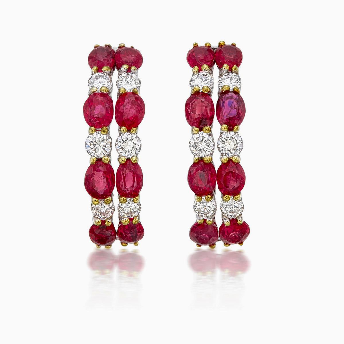 A pair of fine modern ruby and diamond earrings made in 18 Karat gold. This pair of earrings embraces minimalism with it's simple design while still displaying elegance; a great fit for lifestyle wear.

- There are sixteen oval rubies, eight of each