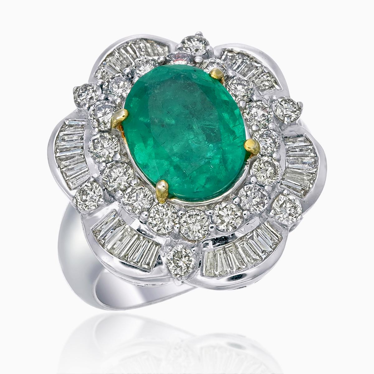 This ring features a 4.00-carat AGL-certified emerald from Ethiopia (Certificate number AGL Thai-0033983), showcasing its green hue. Surrounding the emerald are 0.46 carats of tapered baguette diamonds and 1.04 carats of round-cut diamonds, creating