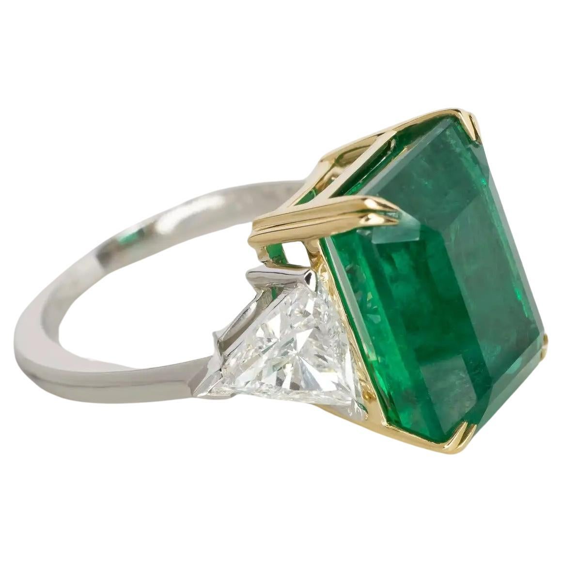 AGL Certified 13.35 Carat Vivid Green Emerald Trillion Diamond Ring 
the main emerald is extremely high quality with minimal inclusions and great color!!
the side trillion diamonds are very high quality and both comes with Grs report.
Set in 18K