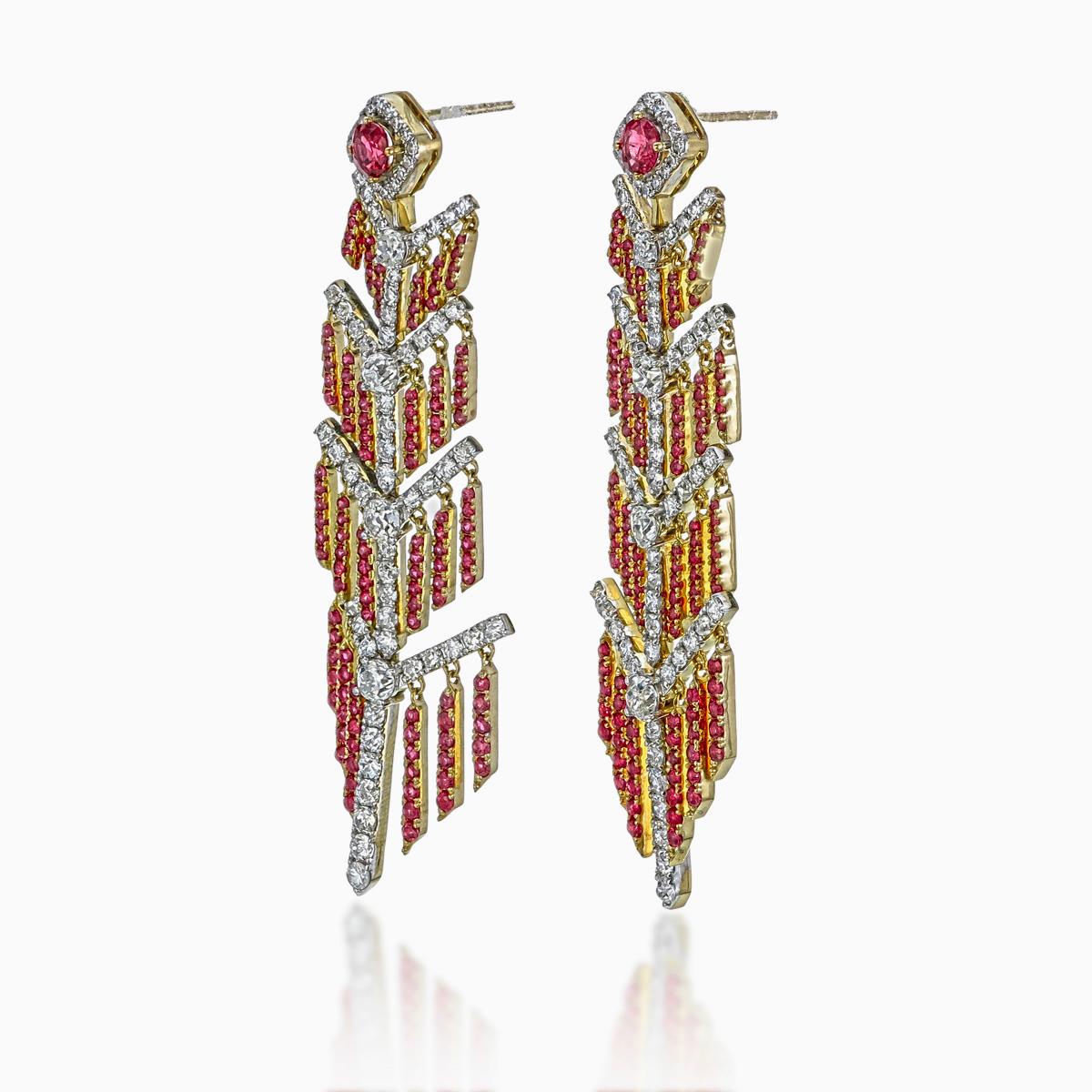 A pair of fine timeless ruby and diamond earrings made in 18 Karat gold. This pair of earrings embraces a classical look with its chandelier design; a great fit for lifestyle and festive wear.

- There are two center oval Pigeon Blood rubies, with