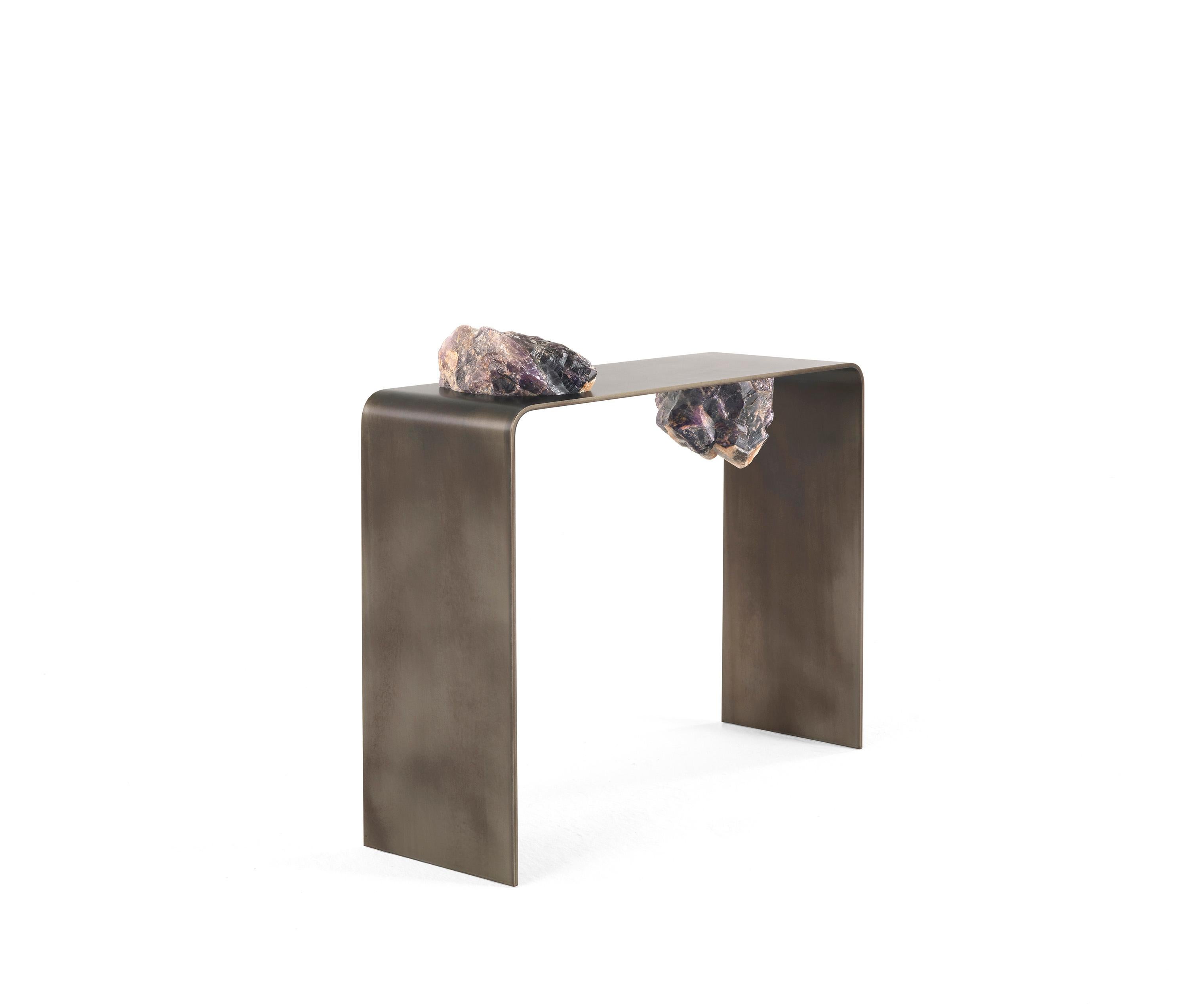 Agment console by CTRLZAK
Materials: Metal structure in bronze finishing with manganese salt treatment. Stone elements in raw Labradorite
Dimensions: 100 x 30 x 110 cm

A fragment from distant planets segmented in two parts.
A separate entity
