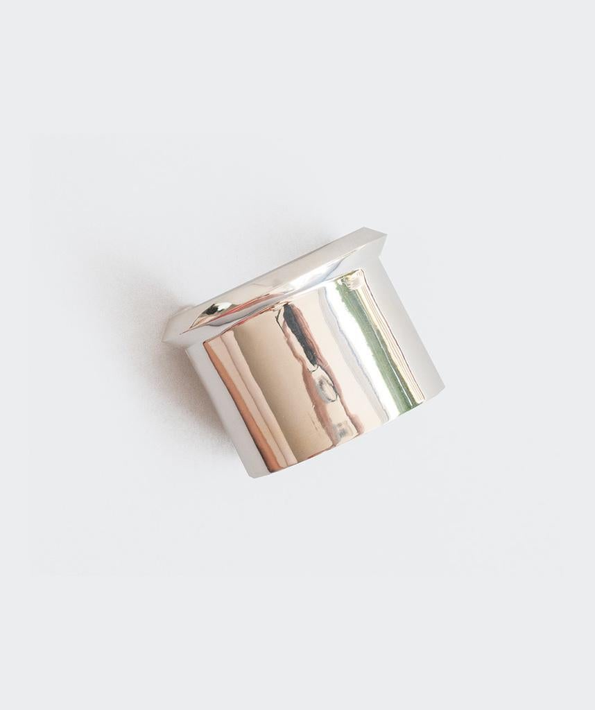 AGMES Sterling Silver Simple and Modern Cuff with Geometric Edge detail.  
Handmade in NYC.  
Inspired by urban landscapes, architecture and modern art, the collection creates a feminine geometry expressed through clean lines and sculptural