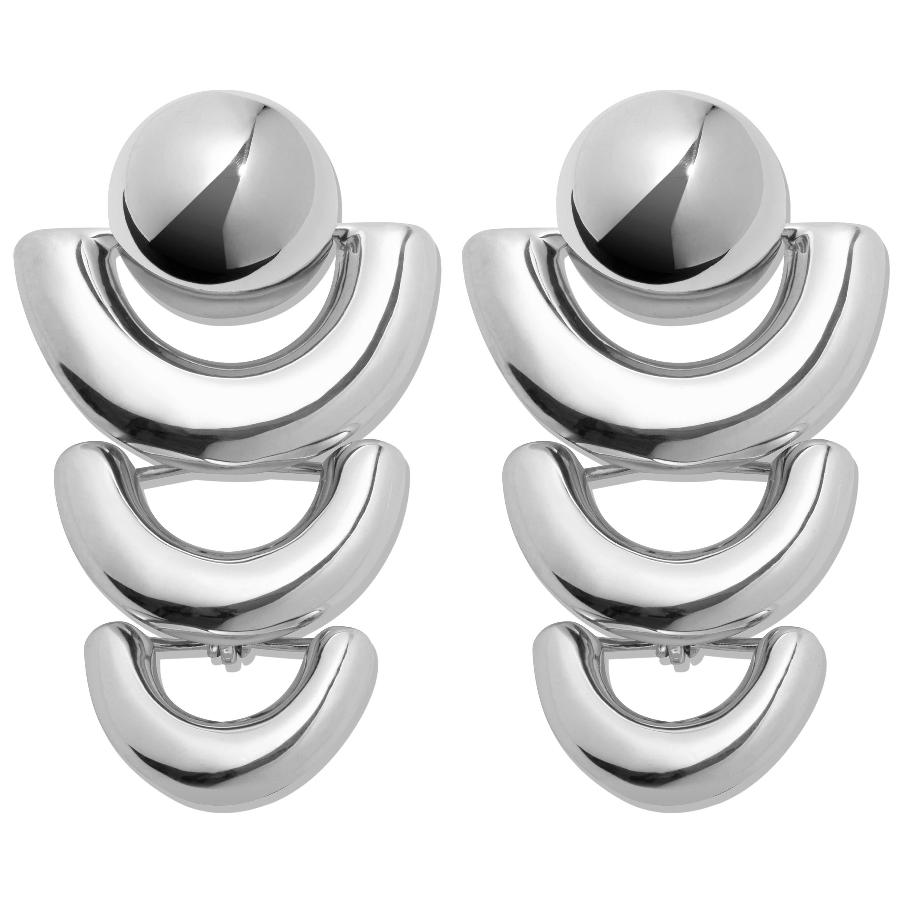 AGMES Sterling Silver Statement Earrings.  
Sterling Silver post.
Matching bracelet available.
Handmade in NYC.  
Inspired by urban landscapes, architecture and modern art, the collection creates a feminine geometry expressed through clean lines and