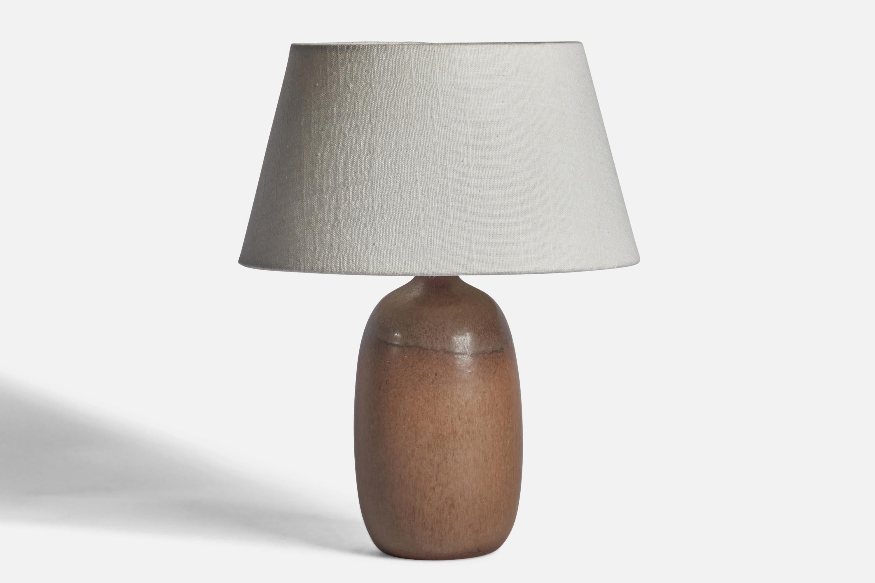 A brown-glazed stoneware table lamp designed and produced by Agne Aronsson, Sweden, 1960s.

Dimensions of Lamp (inches): 10” H x 4.15” Diameter
Dimensions of Shade (inches): 7” Top Diameter x 10” Bottom Diameter x 5.5” H 
Dimensions of Lamp with